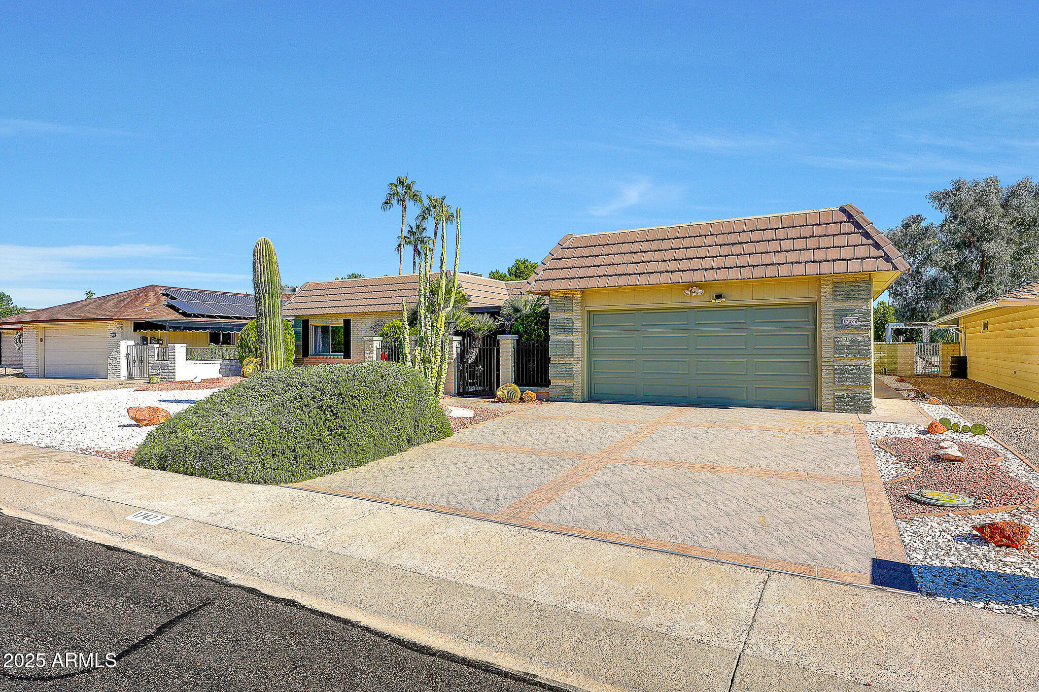 Don't Miss This Castillo Model Home On The Golf Course  With A Pool, In Sun City! From The Moment You Enter The Private Front Courtyard, You'll Feel The Charm Of This Property. Step Inside And You're Greeted With A Bright, Open-Concept Living Space, Walls Have Been Removed To Create An Expansive Flow, And You Can See Straight Through The Home To The Stunning Golf Course View. This Desirable Split Floor Plan Places The Primary Suite On One Side Of The Home And The 2 Guest Bedrooms And Bath On The Other, Offering Privacy For Everyone. The Primary Bedroom Is Spacious And Features Two Walk-In Closets And Doors To The AZ Room.  The Kitchen Is A Galley Layout, And Has Been Updated With Appliances Cabinets And Countertops, And Excellent Workspace. Just Off The Living Room You'll Find A Dining Area Plus Two Bonus Rooms. Adaptable For Hobbies, An Office, Or Additional Lounging. At The Back Of The Home, You'll Love The Massive Arizona Room With Panoramic Views Of The Pool And Golf Course. This Space Is Heated And Cooled With A Mini-Split System, Making It Comfortable Year-Round. Step Outside To Your Personal Retreat: A Sparkling Pool, Surrounded By Extra Patio Space,  For Relaxing. There Is So Much To Enjoy Here, Views, Privacy, Entertaining Space, And A Fantastic Layout. Be Sure To Stop By And See This One Soon!