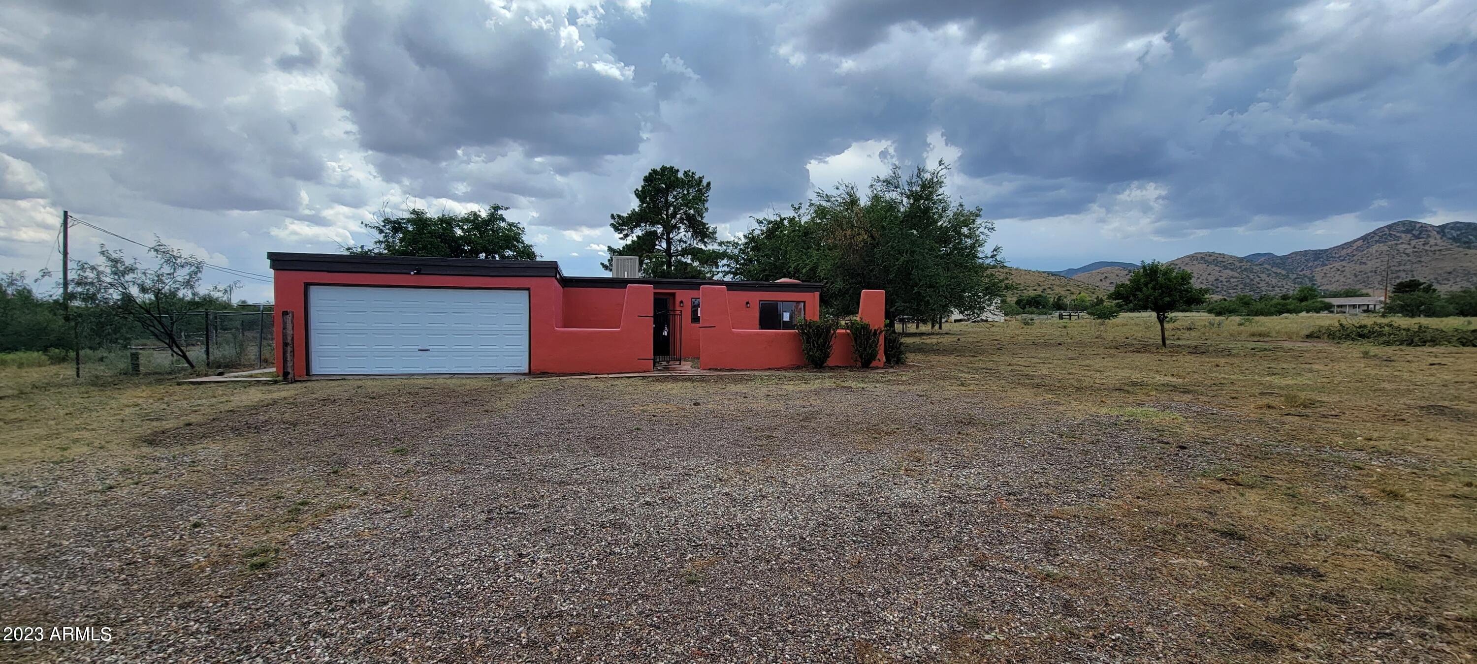 Here is a great opportunity for a site built home on 2 parcels totalling over 2 acres. There is a water company well next to the property for great water pressure! There is an oversized 2 car garage with cabinets for all of your stuff. There is an amazing view of the Dragoon Mountains from your backyard. There is a a large living room with a wood stove for the cool nights ahead.