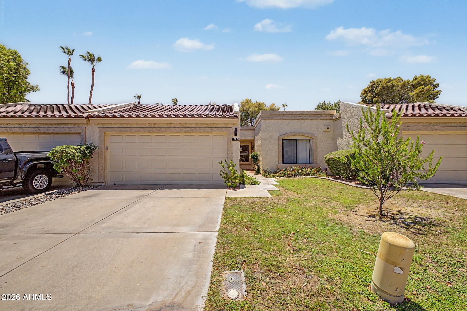 Welcome to this charming move-in-ready home located in a desirable 55+ community, offering comfort, convenience, and a low-maintenance lifestyle. From the moment you arrive, you'll appreciate the well-kept curb appeal with a grassy front yard and attractive landscaping.

Inside, the home features a functional layout with tile flooring throughout the main living areas and cozy carpeted bedrooms. The kitchen offers beautiful cabinetry and a welcoming design with plenty of storage and workspace, making it a great place for everyday living and entertaining.

Step outside to enjoy the private backyard featuring low-maintenance rock landscaping, a covered patio, and additional greenery that creates a relaxing outdoor retreat. The spacious garage is equipped with extensive cabinetry, providing excellent storage and organization.

This home also offers valuable upgrades and peace of mind, including an AC unit approximately 3 years old with a 10-year warranty. The roof is maintained by the HOA and was reported to be only a few years old.

Located in a sought-after age-restricted community with HOA-maintained amenities, this property provides the perfect blend of comfort, convenience, and easy Arizona living.