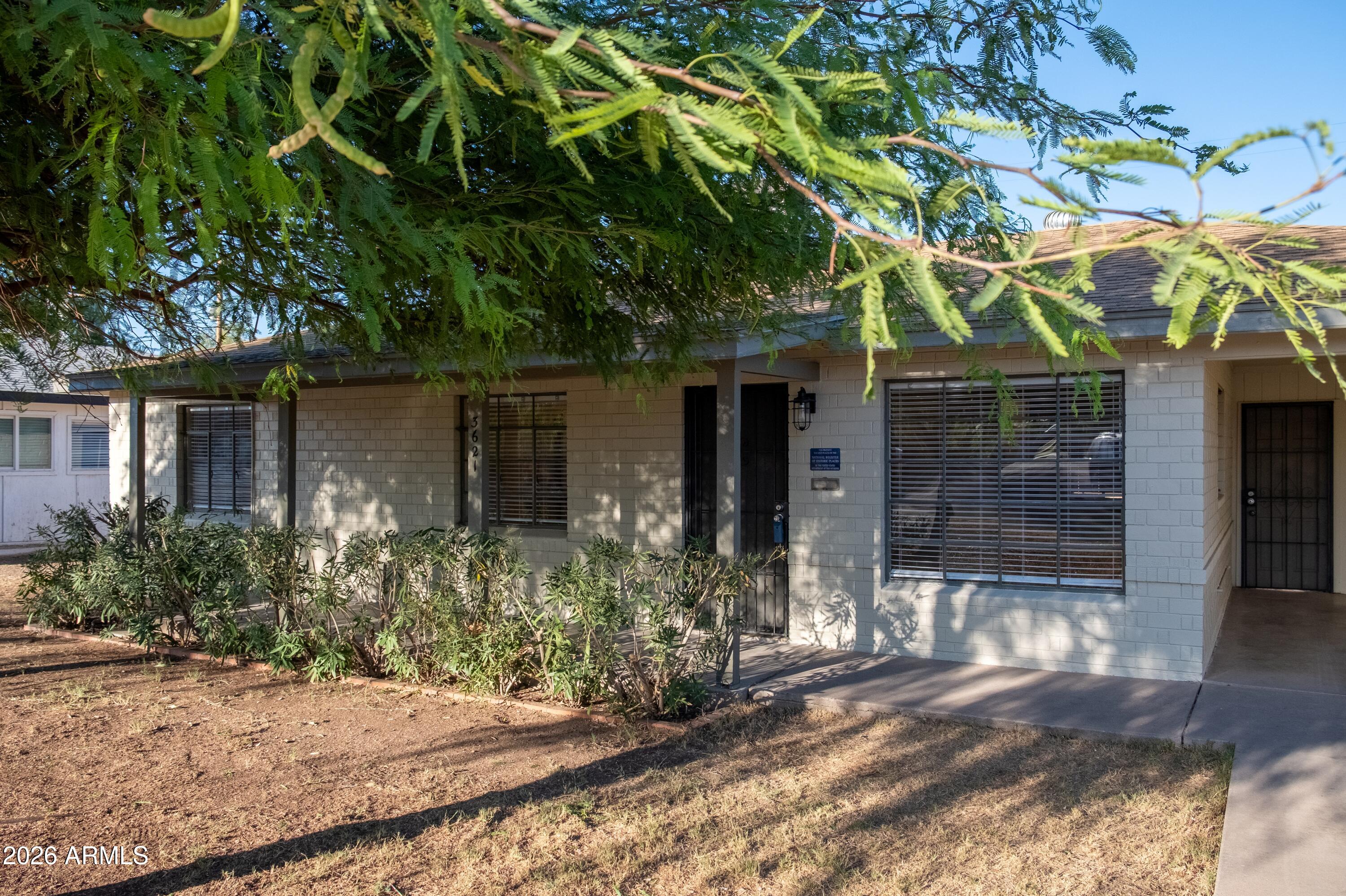 This beautifully restored mid-century modern home connects the past with the present. Care has been taken to preserve the vintage elements of this post World War II home (including the original windows), while carefully integrating modern features. The living room's vintage coved ceilings are an example of the era. This 1 1/2 bath home features 20 inch tile throughout. Recessed lighting provides a modern convenience. The kitchen features period wood cabinetry and gorgeous zinc counters, typically found in high-end homes. Two beautiful mesquite trees shade the front yard, Front and rear landscape watering system. Detached storage building in the back yard! This property is listed as a ''contributor'' to the Westwood Historic District, which could lead to property tax savings. Owner/Broker