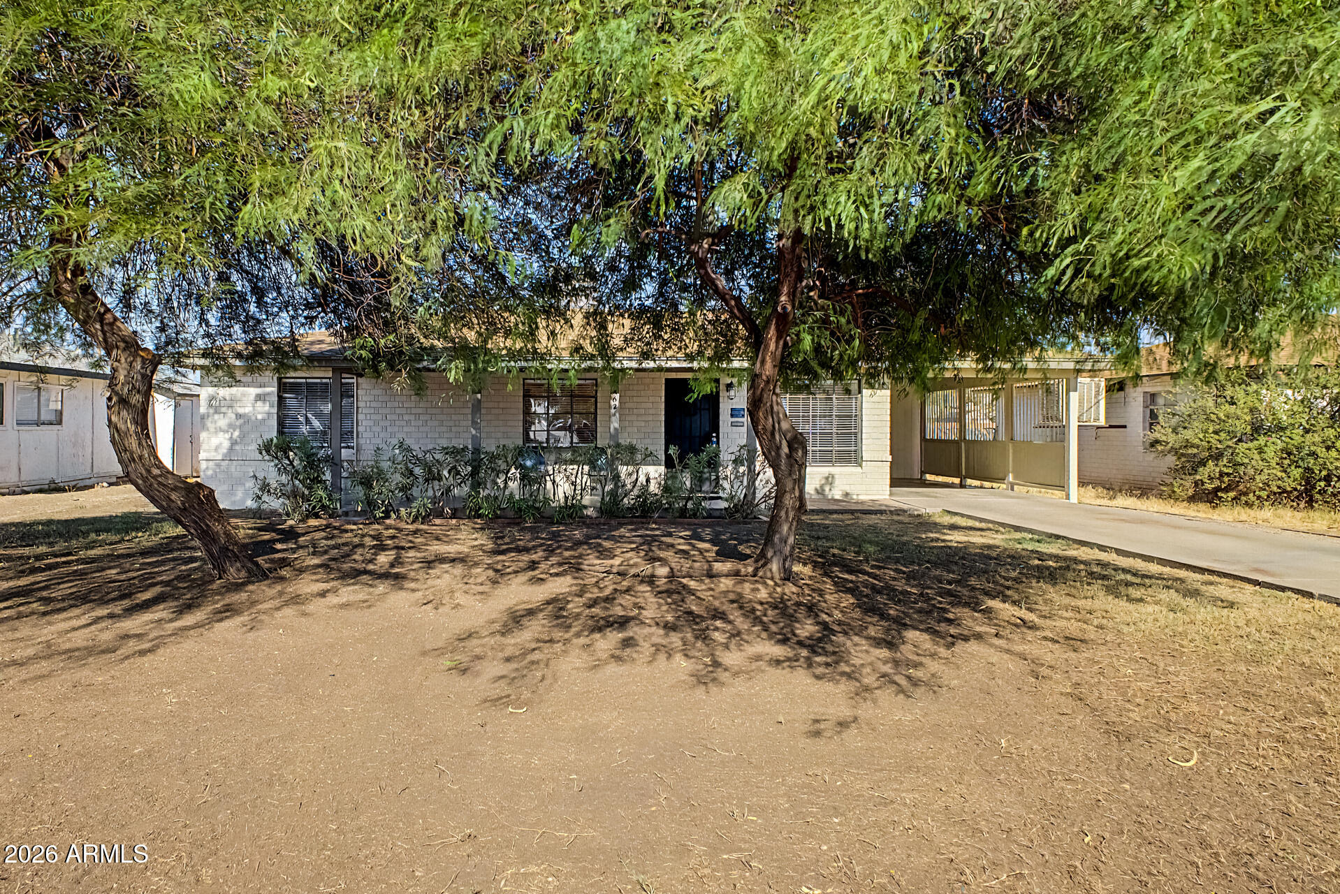 This beautifully restored mid-century modern home connects the past with the present. Care has been taken to preserve the vintage elements of this post World War II home (including the original windows), while carefully integrating modern features. The living room's vintage coved ceilings are an example of the era. This 1 1/2 bath home features 20 inch tile throughout. Recessed lighting provides a modern convenience. The kitchen features period wood cabinetry and gorgeous zinc counters, typically found in high-end homes. Two beautiful mesquite trees shade the front yard, Front and rear landscape watering system. Detached storage building in the back yard! This property is listed as a ''contributor'' to the Westwood Historic District, which could lead to property tax savings. Owner/Broker