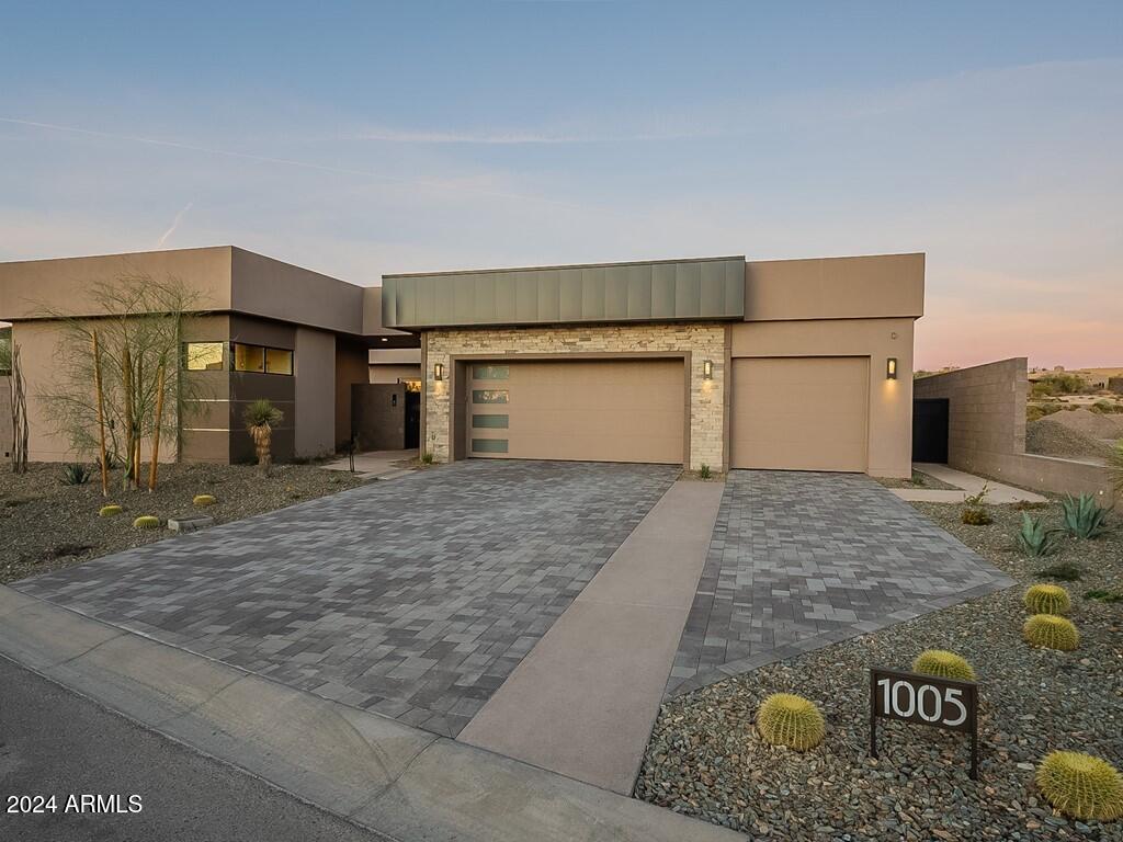 SAND DUNE SERENITY IS A FULLY FURNISHED TURNKEY NEW CULLUM HOME! FULL DESERT MOUNTAIN GOLF MEMBERSHIP AVAILABLE! ENTERING THE GATED ENTRANCE WELCOMES YOU TO THE SOUND OF A BUBBLING FOUNTAIN IN THE QUAINT LANDSCAPED COURTYARD WITH GUEST CASITA AND TOWERING GLASS FRONT DOOR. UPON ENTERING THE MAIN HOME YOU WILL NOTICE THE VIEW STRAIGHT THROUGH THE HOME OVERLOOKING THE WATER AND GREEN OF THE 13TH FAIRWAY OF THE RENEGADE COURSE. THE CHEF'S KITCHEN ADORNED WITH SUB ZERO REFRIGERATOR, WOLF COOKTOP, OVENS AND COVE DISHWASHER ALL OVERLOOK THE LIVING AND ENTERTAINING SPACE. THE DINING AND GREAT ROOM WITH HIGH CEILING, FIREPLACE WITH BUILT IN SHELVING AND WALL OF GLASS OPEN ONTO THE ENTERTAINERS DREAM BACKYARD. THE SWIMMING POOL, BUILT IN BBQ, FIRE PIT AND LARGE COVERED PATIO HAVE AN AMAZING VIEW OVER THE RENEGADE COURSE, POND AND MOUNTAINS IN THE DISTANCE. THIS IS A GREAT PLACE TO ENJOY THE WINTER SUN. THE PRIMARY SUITE HAS A DESIGNER TOUCH WITH A STONE WALL ACCENT AND LARGE FIREPLACE FOR THOSE COOL EVENINGS. THE LARGE BATH WITH SEPARATE SINKS, SHOWER, SOAKING TUB AND CUSTOM CLOSET TO GET READY IN. TWO EN-SUITE BEDROOMS THAT ACCOMMODATE KING SIZE BEDS ARE ALL SEPARATE FROM EACH OTHER WITH ONE OPENING INTO THE PRIVATE COURTYARD. THE LARGE OFFICE WITH COURTYARD VIEW, LAUNDRY AND POWDER BATH COMPLETES THIS SINGLE LEVEL LIVING HOME. GUESTS WILL NEVER WANT TO LEAVE IN THEIR OWN CASITA WITH LARGE BATH. THE OVERSIZED 3 CAR GARAGE WITH EPOXY FLOORING IS LARGE ENOUGH TO STORE THAT GOLF CART. THIS HOME WILL BE MOVE IN READY BY YEARS END JUST IN TIME TO ENJOY ALL THAT DESERT MOUNTAIN HAS TO OFFER! BRING YOUR CLUBS AND GET ON ALL OF THE SEVEN COURSES!