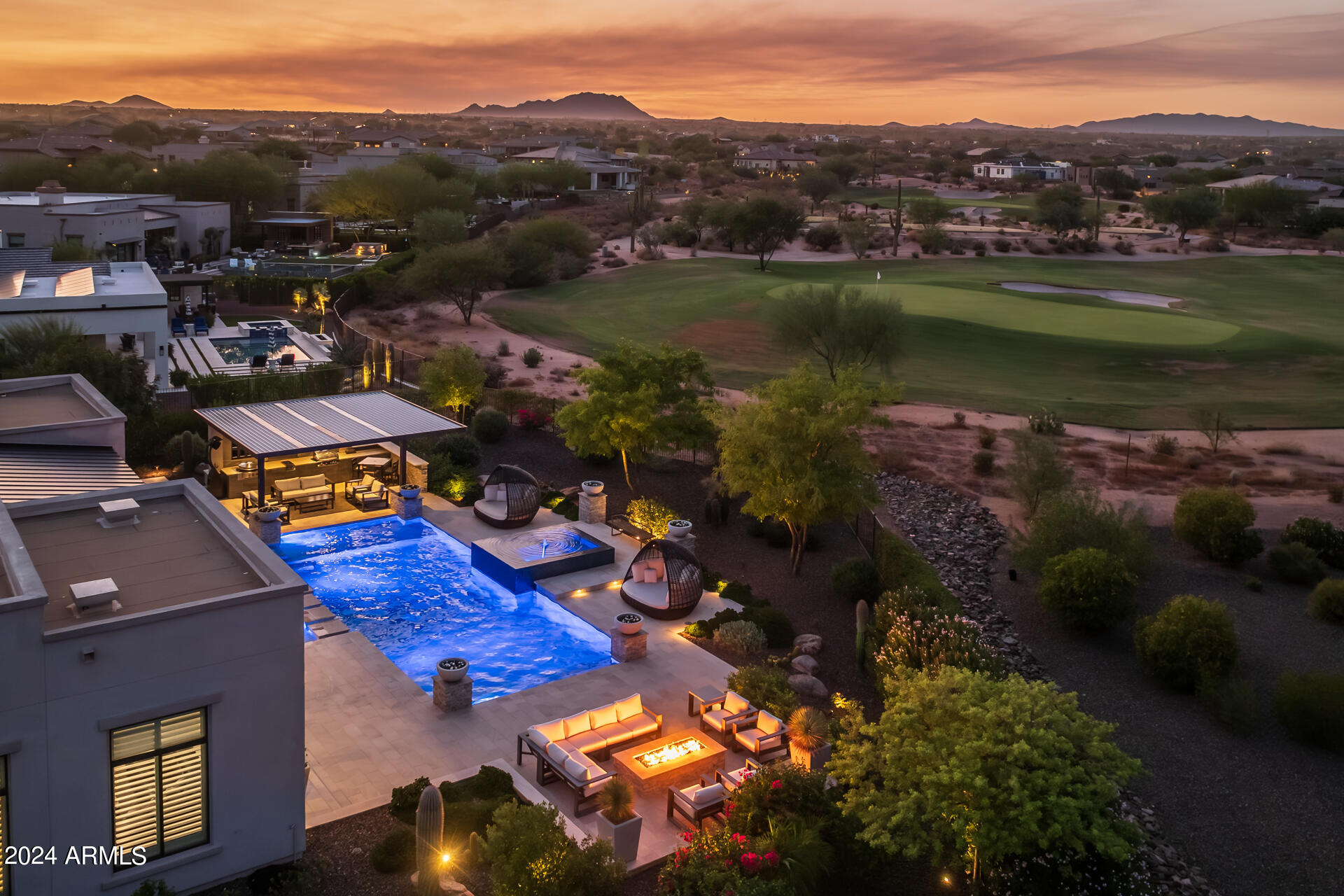 Nestled within the well-sought-after guarded gate community of Trilogy at Verde River, this luxury residence epitomizes refined living with its prime location overlooking the 4th Green and breathtaking mountain vistas. Situated on an expansive 24,500+ sqft lot, no detail was spared in the design of this exquisite home. The grand entry foyer is a showstopper, featuring dramatic high ceilings and elegantly surrounded by sleek tile walls, creating a stunning first impression. As you enter the great room, you'll be captivated by the refined upgrades, including dropped beamed ceilings, floor-to-ceiling fireplace, and clean, neutral tones that enhance the spacious interior. Natural light floods the room through skylights and a center-open multi-panel sliding glass door, seamlessly connecting to the resort-style backyard. The gourmet kitchen features an island with designer pendant lighting, complemented by high-end stainless-steel appliances and stacked cabinetry. The strategically placed butler pantry bridges the kitchen and dining room and is complete with 2 wine refrigerators. The entertainment room is spacious and fitted with a sink, beverage refrigerator, built-in cabinetry, and a sliding door that opens up to the covered patio! The primary suite exudes luxury with built-in cabinets, custom shutters, and an ensuite bathroom featuring a soaking tub, dual-entry tiled shower, bidet toilet, and his-and-her custom walk-in closets by Classy Closets. The private casita has an entrance from the front courtyard and offers a living room, bedroom, and ensuite. This luxurious backyard is an entertainer's dream, featuring an oversized pool with mesmerizing fountains that change colors, creating a private water show against the backdrop of stunning mountain views. The elevated spa adds a touch of relaxation, while the custom pergola offers a high-top counter, a TV, and an EVO grill, BBQ, and cooktop. Whether hosting or unwinding, this space blends beauty and functionality for unforgettable outdoor living. This home offers a blend of elegance and comfort, perfect for those seeking the pinnacle of desert living in Trilogy at Verde River.


The amenities at Trilogy at Verde River are World Class with Tom Lehman-inspired eighteen-hole golf course, tennis courts, pickleball courts, and bocce ball, heated lap pool and resort-style swimming pool, hot tub, Afterburn fitness center, Helen's demonstration Kitchen for cooking classes and a 7.5 acre dog park. The community center has casual poolside dining at Eddy's Diner and gourmet dining at award-winning Needle Rock Kitchen and Tap, Alvea Spa with full-service Salon and Spa amenities, Art Loft and events center. Trilogy at Verde River is adjacent to the Tonto National Forest and is situated in the middle of miles and miles of hiking and biking trails.