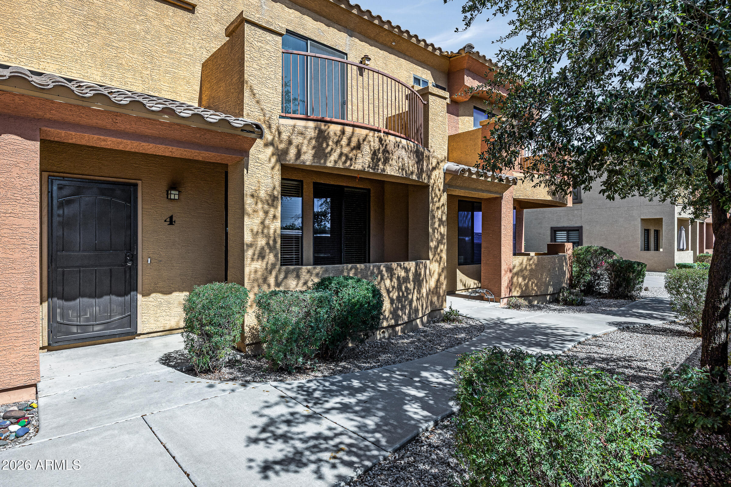 Welcome to this beautifully maintained townhome located in a gated North Phoenix community just minutes from the Loop 101, SR-51, shopping, dining, and hiking trails. This spacious 2 bedroom, 2.5 bathroom home offers an ideal blend of comfort, convenience, and low-maintenance living.

Inside, you'll find an open-concept floor plan with generous living and dining spaces, abundant natural light, and a functional layout perfect for everyday living or entertaining. The kitchen features ample cabinetry, plenty of counter space, and flows seamlessly into the main living area. Upstairs, both bedrooms offer en-suite bathrooms, creating ideal privacy for roommates, guests, or a work-from-home setup.

Additional highlights include an attached garage, indoor laundry, guest powder room downstairs, a private outdoor patio space. The gated community offers a resort-style feel while remaining close to everything North Phoenix and Paradise Valley have to offer.

Whether you're a first-time homebuyer, winter visitor, investor, or simply looking for a lock-and-leave lifestyle, this home is an exceptional opportunity in a highly convenient location.