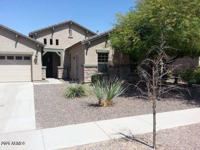 Introducing Rockwell 6071 in Gilbert, AZ -- a spacious 5-bedroom, 3-bath home with thoughtfully designed living spaces. The floor plan includes separate living and family rooms plus an entertainment nook, offering flexible space for daily living and hosting. The kitchen is equipped with all appliances and granite counters. A private entrance leads to one bedroom for added convenience, and a fireplace adds a focal point to the main living area. This home blends functional features with comfortable design in a desirable Gilbert location.