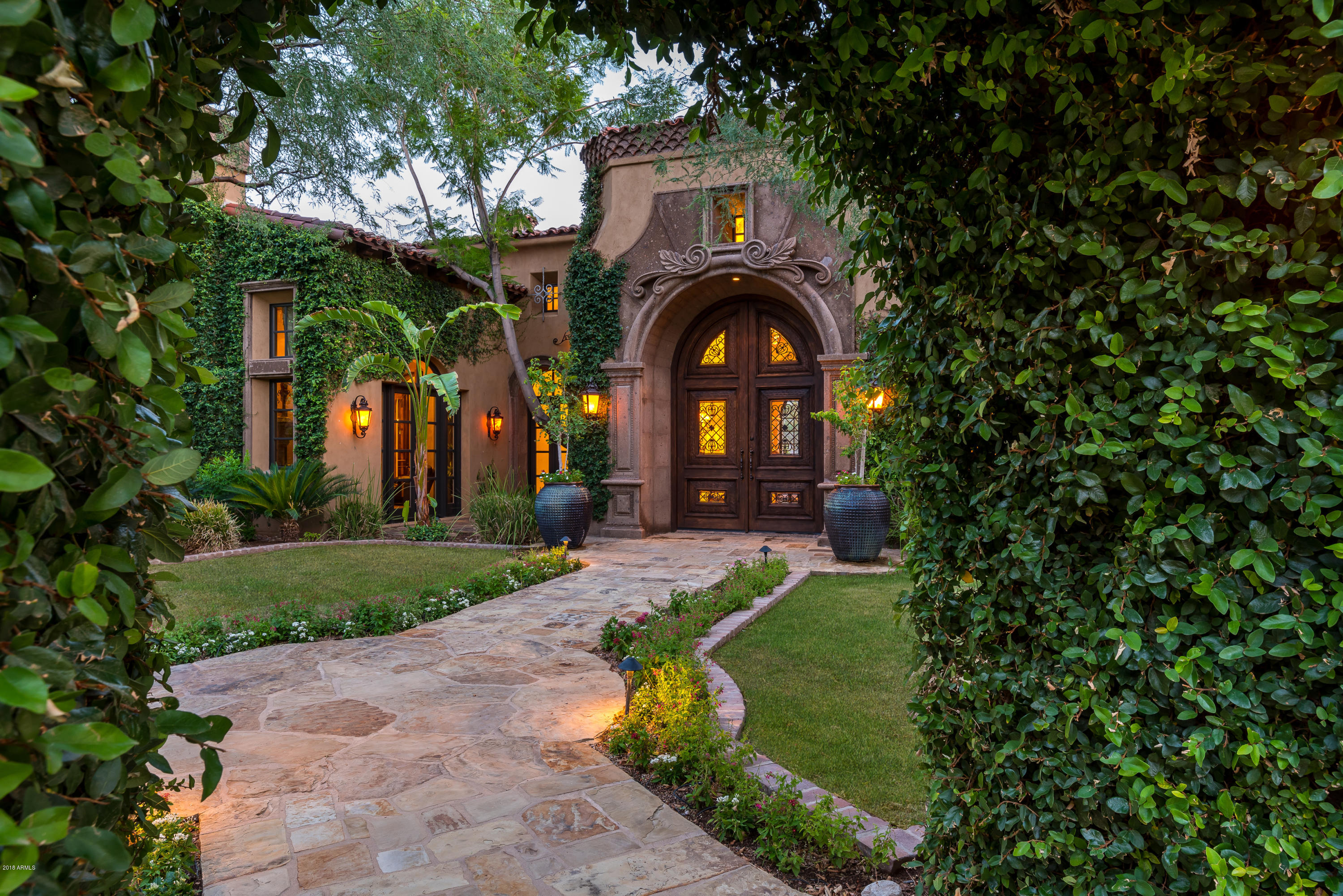 (RECENTLY REDUCED OVER $1M) - Nestled in the Upper Canyon of Silverleaf you will find this one of a kind compound. Master suite includes a private outdoor spa, separate his & her bathrooms/closets, and see-through fireplace. This primary residence (10,139 square feet) and separate guest house with full kitchen (724 square feet) were designed to entertain and are equipped with 14 fireplaces, 2 fire pits, 7 high ceiling garages (capable of holding 11 cars comfortably with lifts), 2 separate BBQ stations, 2 fire pits, 2 private courtyards and more!
