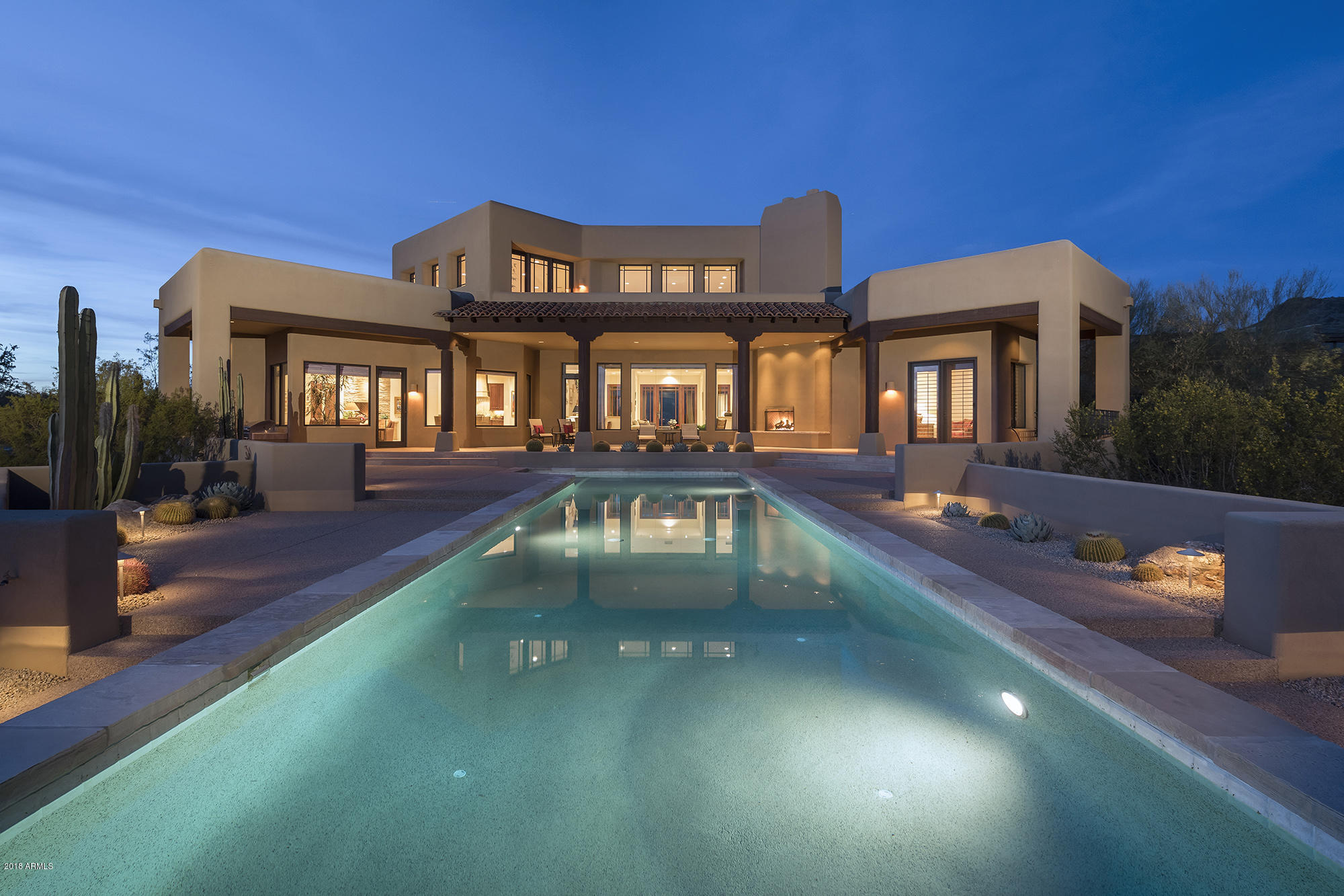 Remarkable price adjustment in The Country Club of DC Ranch.  Lot alone worth $2M. Surrounded by the 17th & 18th holes, picking up views of city lights and sweeping vistas of the valley below to the south, the location is an A+.The views enhance this custom estate home as well as the simple and clean lines of the architectural style. The timeless interior finishes are a welcome backdrop for transitional, contemporary or traditional furnishings.The home is primarily single story, with four bedrooms and casita on the main level and bonus room on the second story.Whether you are enjoying the charming front courtyard or the large lap pool in the generous outdoor living area, this home flows seamlessly and is perfect for entertaining large groups or intimate family gatherings.