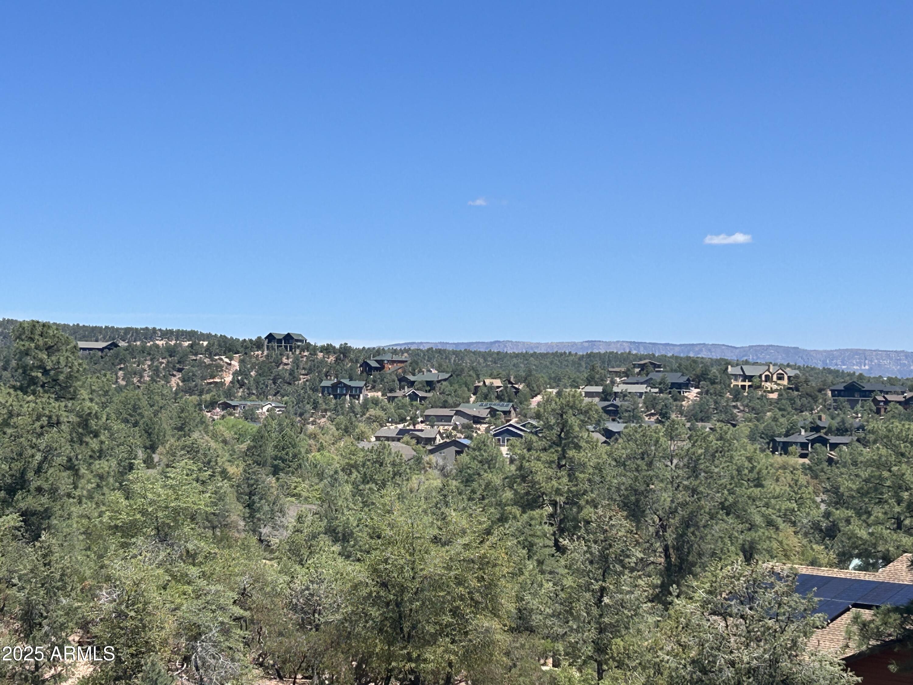 Beautiful Views expand to the East and North from this Hillside Homesite at the end of a Cul de Sac. Just under a half an acre and located in a quiet spot in Chaparral Pines makes this a prime location for your next residence.