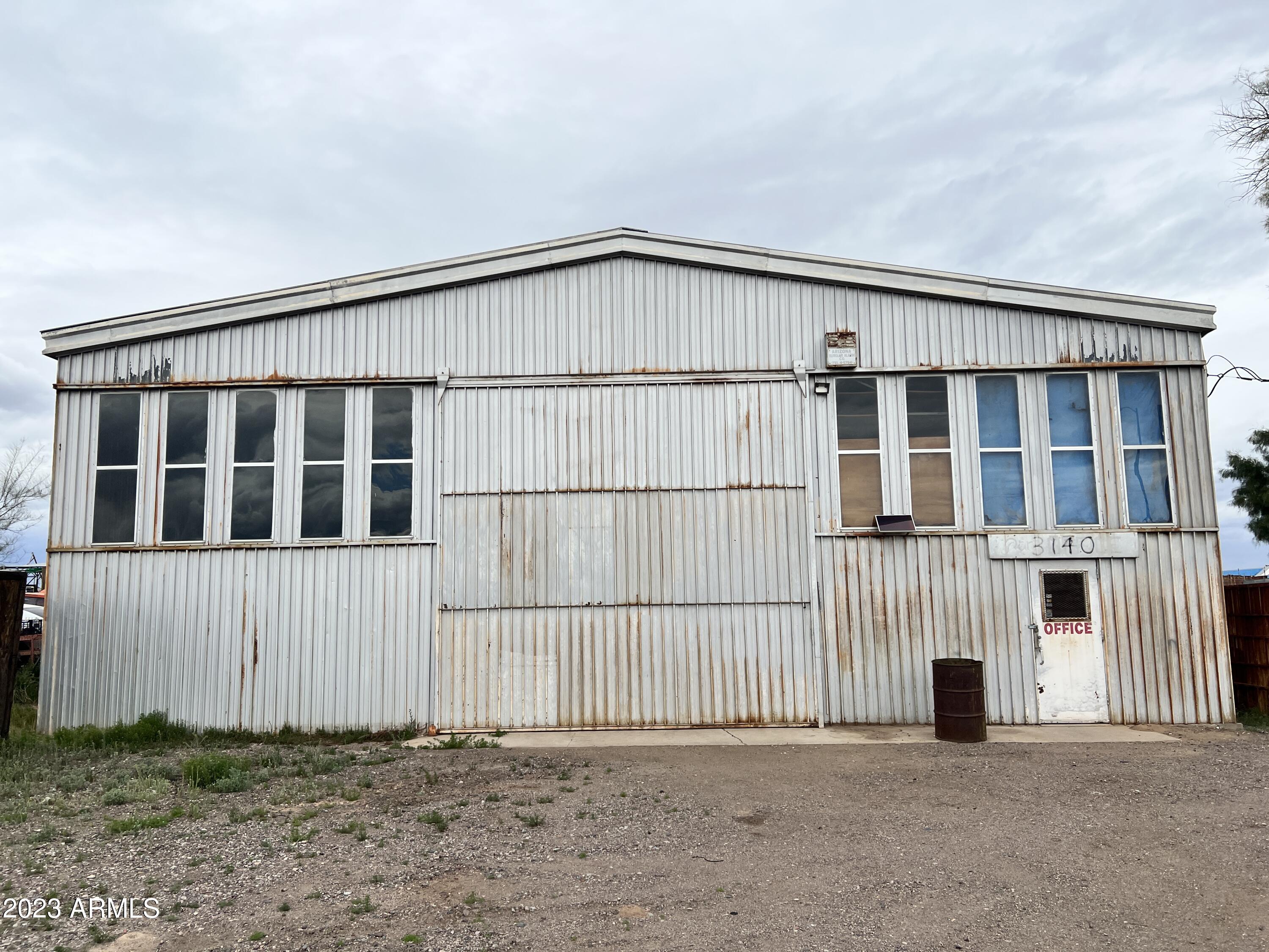 Rare opportunity to acquire a large, flat rectangular lot with great zoning for a variety of uses. Two 3200 sq ft steel buildings allow for a multitude of uses. Vacant. New fencing and gate at front. Ready for new owner. Zoned A-2 Industrial (city) and I-2 Heavy Industrial (county)