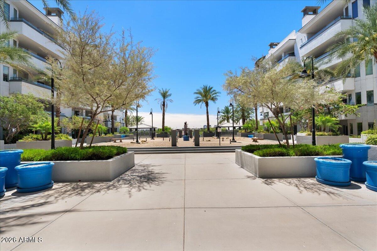 Luxury modern Resort living on the North Shore of Tempe Town Lake. ~Owners want it SOLD! ~Ideally suited for professionals &  ASU students. The 2 bedroom split floorpan bracket the spacious & updated kitchen; w/ a pantry. The counter with colorful bar stools spills into the great room. Then step outside from the wall of windows onto your private balcony, replete with a fireplace & there's also balcony access from your Primary BR that's En Suite + ample closeting. Many details including a laundry room with washer, dryer ~ many other upgrades found in this penthouse-like property. Underground parking is highly desirable as are the workout facilities, on property pool and high security entrance in this luxe address. Furnishings available under separate bill of sale so it can easily turnkey!