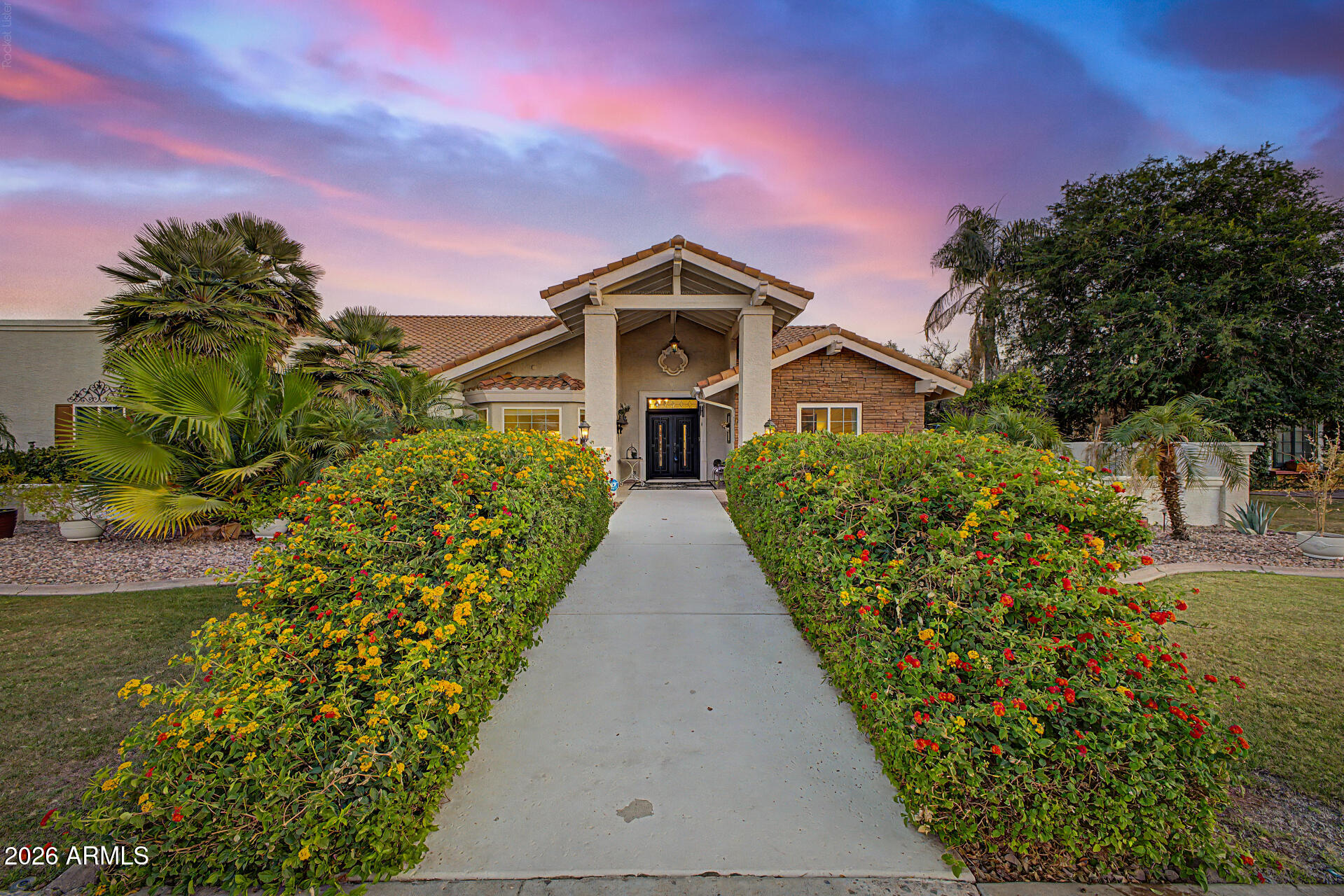 Nestled on a premium cul-de-sac corner lot in the coveted Estate Groves community, this exceptional residence offers the perfect blend of luxury, privacy, and modern efficiency with owned Tesla solar panels, NO HOA, and RV parking. Thoughtfully redesigned for elevated living and effortless entertaining, the home features an expansive floor plan with formal and casual living spaces, a stunning chef's kitchen showcasing marble countertops, custom Alder cabinetry, a massive island, and premium Monogram appliances. French doors create seamless indoor-outdoor flow to a resort-style backyard retreat.
Enjoy year-round relaxation in the heated saltwater pool with Baja shelf and water feature, surrounded by lush landscaping, mature trees, expansive patio space, and exceptional privacy. The luxurious primary suite offers direct patio access and a spa-inspired bath with a marble shower, soaking tub, designer finishes, and a custom closet.
A rare combination of sophisticated design, exceptional upgrades, energy efficiency, and resort-style amenities in one of Mesa's most desirable neighborhoods.
