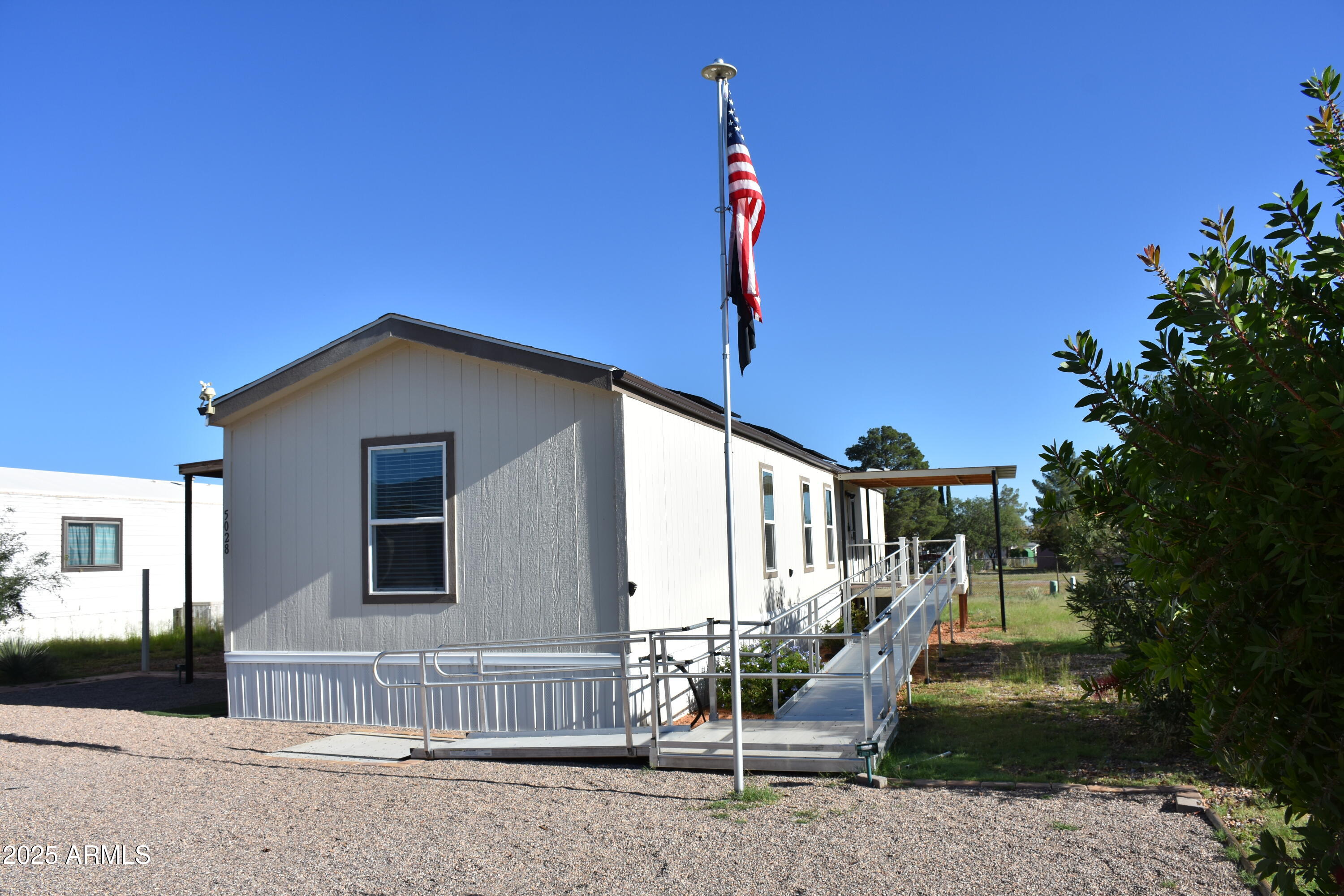 Newer very well maintained single wide mobile home located in Golden Acres.  Three bedrooms, two bathrooms, handicap accessible.  New ramps, shower in main bathroom, has covered patio decks.  Solar panels paid in full.  Water softener, washer and dryer and irrigation system. Move in Ready.