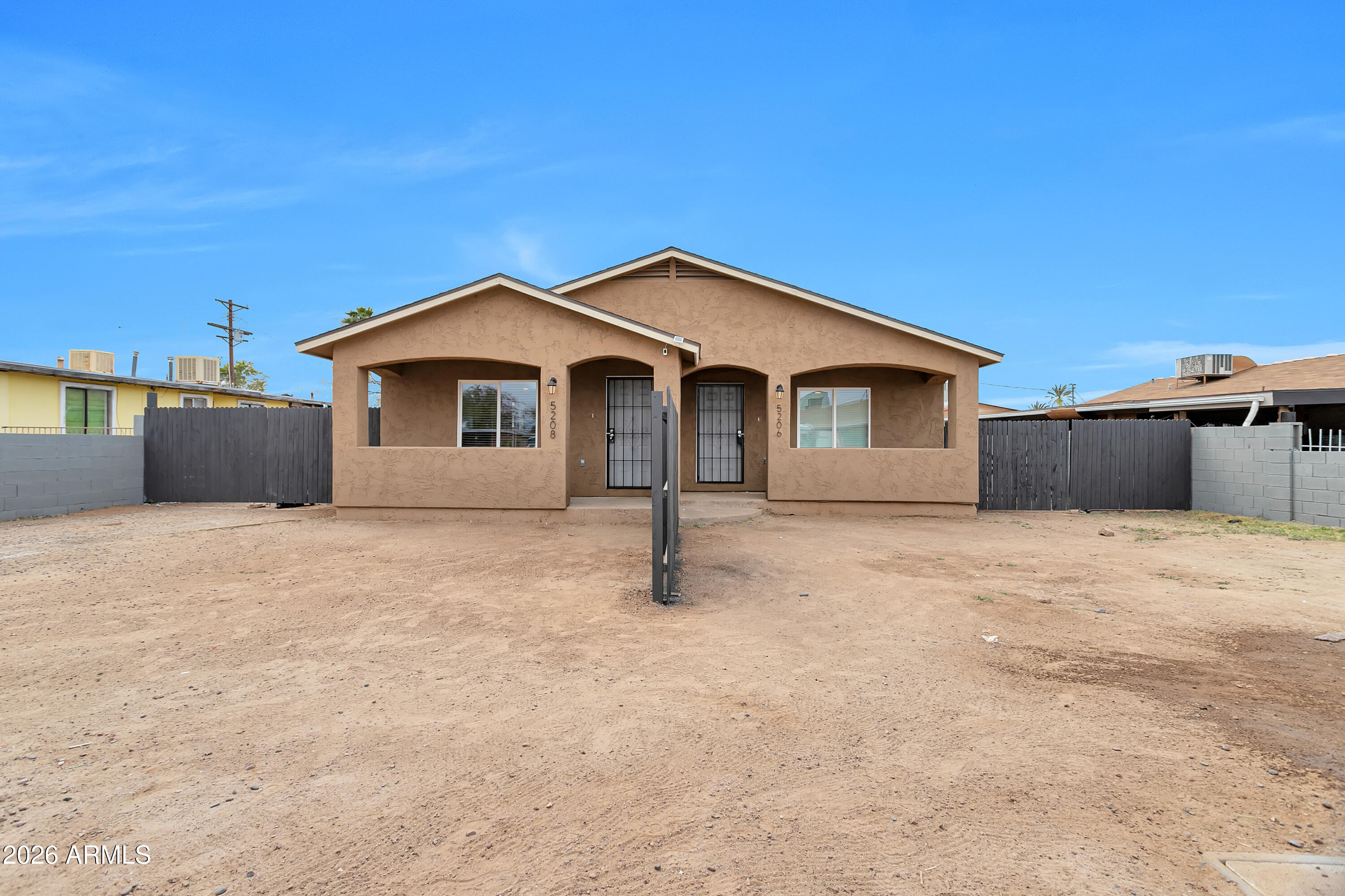 Welcome to an outstanding investment opportunity in desirable South Phoenix! This beautifully renovated duplex offers the perfect blend of strong cash flow, modern finishes, and strategic location--plus the flexibility to build equity while living rent-free. With two identical side-by-side units currently generating $3,520 in gross monthly rent, this turnkey property delivers immediate returns with minimal landlord involvement, or pursue a smart owner-occupancy strategy by living in one unit while rental income from the other covers your mortgage. Each spacious 2-bed, 1-bath unit features elegant, high-quality finishes throughout with updated kitchens showcasing white Shaker cabinetry, granite countertops, stainless steel appliances, and recessed lighting that creates a bright, modern aesthetic. Full bathrooms impress with new tiled showers, updated vanities, and contemporary fixtures. Open-concept living areas flow seamlessly, complemented by abundant natural light and new dual-pane windows that let in Arizona's beautiful weather year-round. This property is essentially brand new inside and out with a brand-new roof, new HVAC systems, and freshly updated plumbing and electrical throughout--completed in 2019-2021. The combination of structural integrity and modern efficiency means minimal maintenance concerns for years to come. Each unit boasts private front and backyards--a rare find in the duplex market. The huge fenced back area with convenient gates offers ample space for RV or boat storage, entertaining, or simply enjoying Arizona's stunning sunsets. Separately metered electric and water (yes for water as well) for each unit mean transparent billing and simplified tenant management, while low-maintenance front landscaping keeps curb appeal high without the headache. Current leases expire 12/31/2026 and 11/30/2026, providing excellent timing to implement your desired strategy--whether that's maintaining strong investor cash flow or transitioning to owner-occupancy with flexible rental options. Just minutes from Sky Harbor International Airport and downtown Phoenix, this neighborhood offers unbeatable convenience and is experiencing significant growth with new construction and exciting development projects nearby, positioning this as a strong value play. This is true turnkey real estate--fully occupied, fully renovated, fully metered with an attractive cap rate and low vacancy risk. Property is strictly drive-by; please do not disturb tenants. Walkthroughs available after contract acceptance. Don't miss this rare opportunity to acquire a premium duplex investment with immediate cash flow, modern finishes, location advantages, and the flexibility to customize your ownership strategy. Buyer to verify all facts and figures.