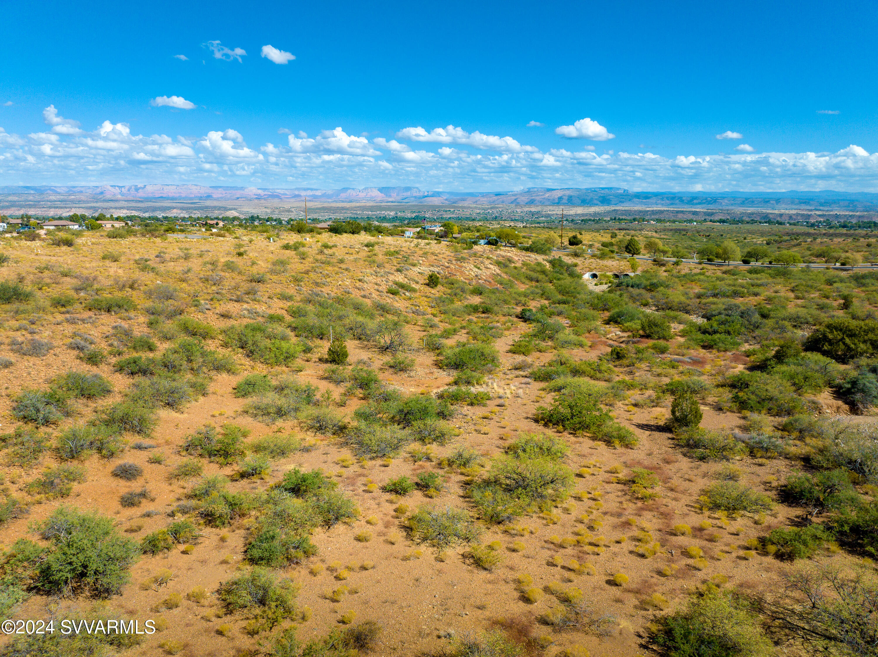 Buy and hold—or buy and build! Incredible 1.61-acre lot in prestigious Quail Canyon Estates with breathtaking views of Mingus Mountain and the Red Rocks of Sedona. Enjoy natural high desert landscaping, paved road access, and a prime location just minutes from Sedona, Old Town Cottonwood, wine country, hiking, and more. Gated community with underground utilities, private water, and natural gas. Ask about custom land/home packages from Lawler Construction—voted Verde Valley's BEST Builder—offering options like RV garages, guest casitas, and more. Rare opportunity in a stunning setting!
