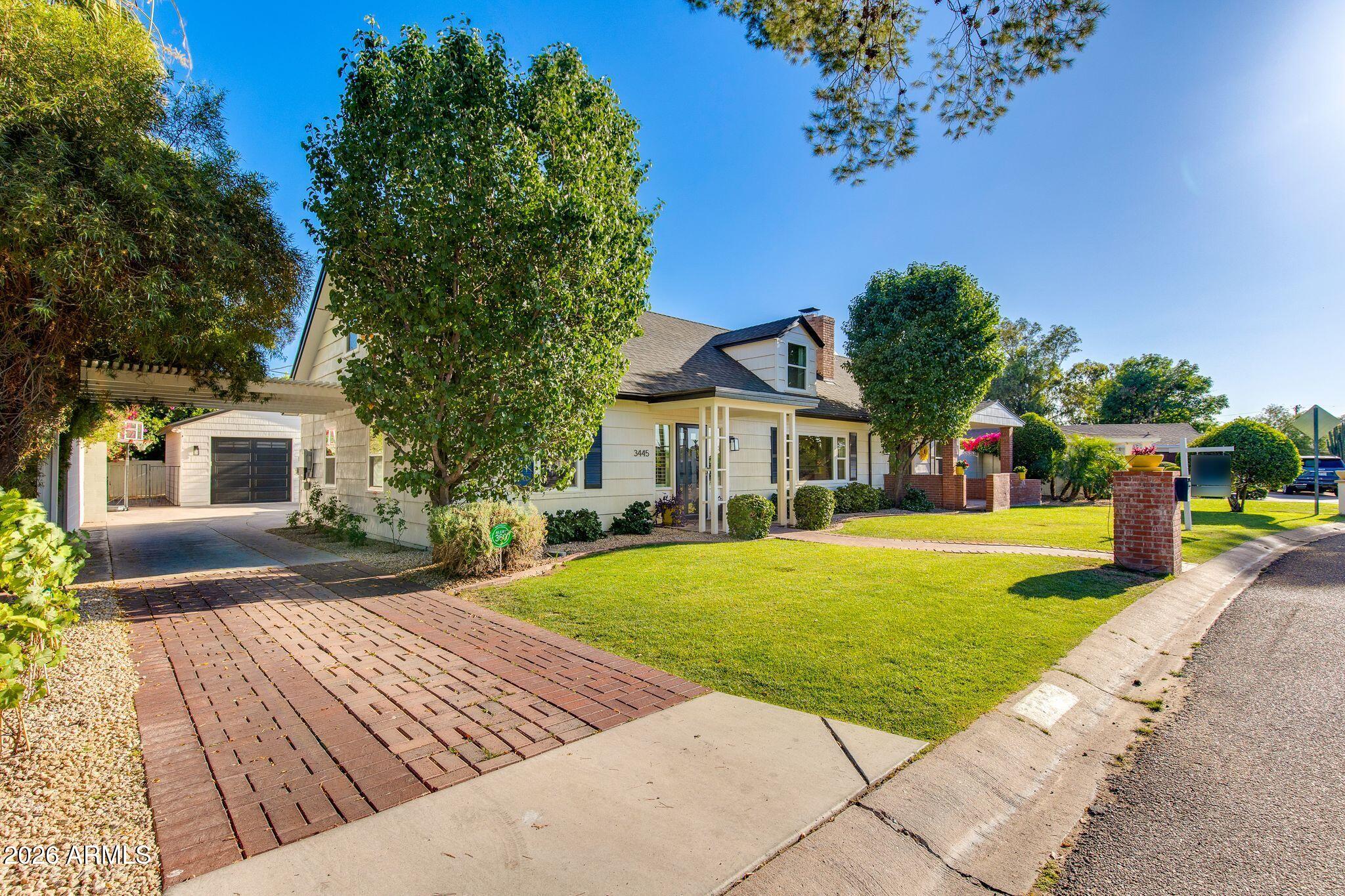 In the heart of Biltmore Heights, this thoughtfully curated home captures the lifestyle that makes this community so special. Just moments from the canal path, hiking trails, Biltmore shopping, & some of Phoenix's best dining, the location offers the perfect balance of energy & charm. Inside, wood flooring, remodeled baths, & multiple living spaces create an inviting, timeless feel. The kitchen flows seamlessly to a resort-style backyard featuring a heated pool, expansive covered patio, outdoor BBQ/bar, citrus trees, & flex-use spaces to relax or entertain year-round. The spacious primary offers a spa-inspired bath & oversized custom closets, while the separate studio off the oversized 2-car garage is ideal for a gym or office. Owned solar and countless updates & features throughout!