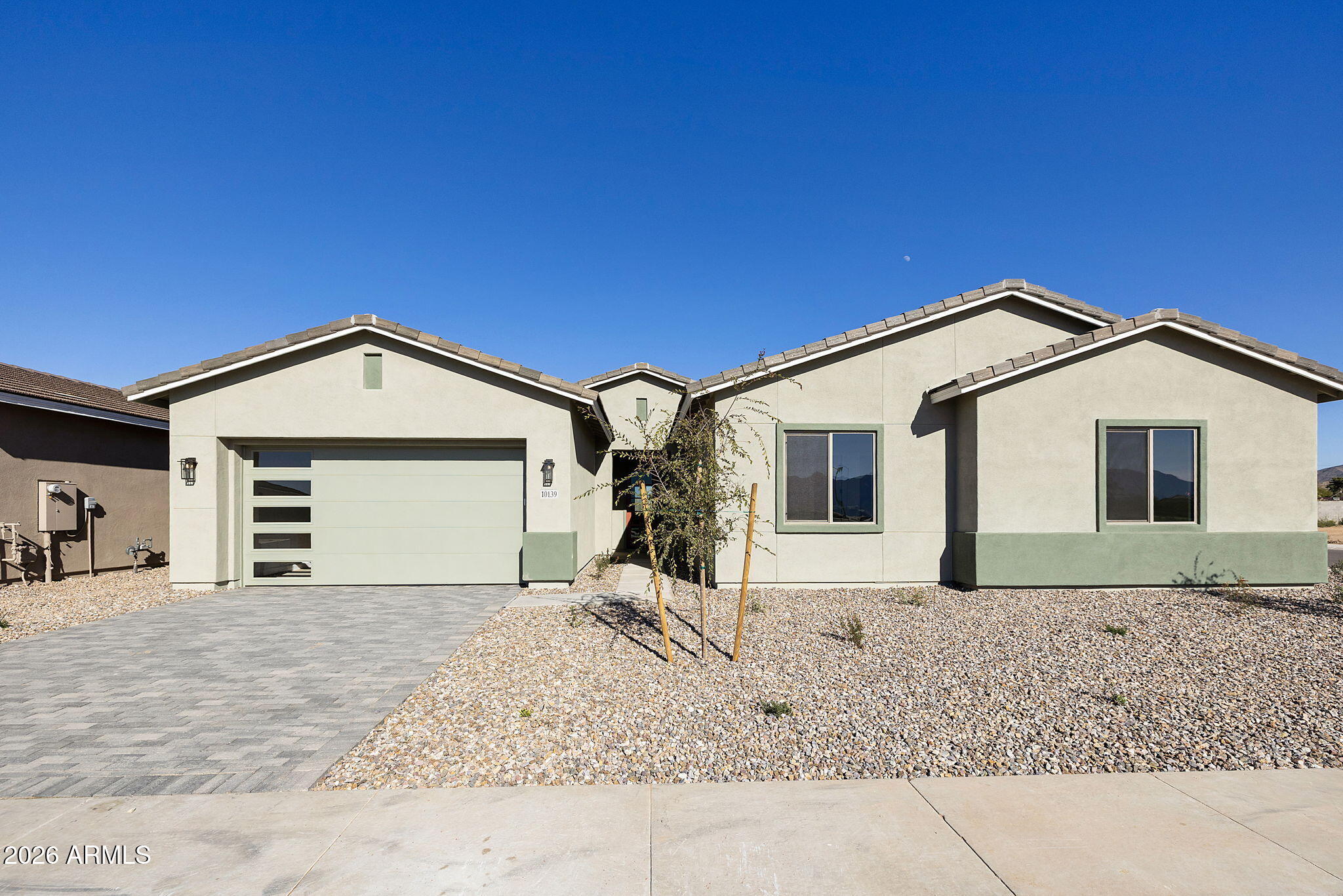Your wait for a luxury home in Laveen is over!  Come visit Laveen's newest upper end community!  This beautiful community is surrounded by mountain views of the Estrella Mountains and Carver Mountain.  This beauty is NOW COMPLETED With all of the upgrades that you could want in a new home. Included features such as Gourmet Kitchens with Built-in Gas Cooktop, quartz counters, maple full overlay shaker cabinets with a painted island, and designer backsplash, 10' ceilings, 8' interior doors, teen suite, flex room, oversized laundry room with cabinets. 4 CAR GARAGE!    Beautiful wood plank tile flooring throughout except for the bedrooms. Come look at our views and these brand-new plans and fall in love with your new dream home. HOME IS NOW COMPLETED!!!