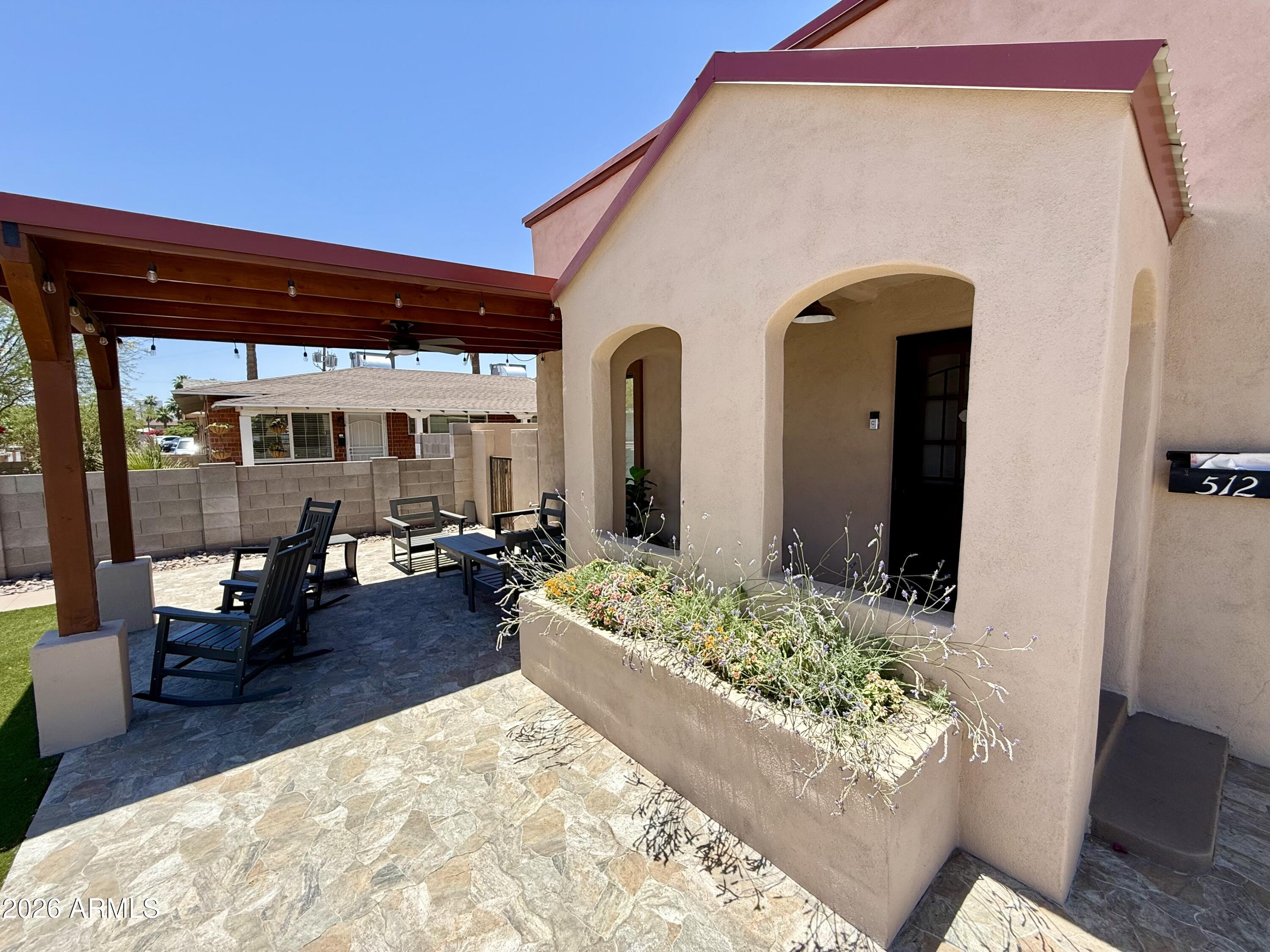 Be at the center of it all in this crisp 1930 Spanish/Southwestern-style home Downtown adjacent! Offering 4bed/2bath and approximately 1700sf. This move-in-ready residence blends historic with modern updates. 2025 improvements include luxury vinyl flooring, 2 remodeled baths, energy-efficient windows, granite countertops & a charming fireplace. Enjoy a private backyard pickleball court that doubles as an exceptional entertaining space, while the covered front patio captures city skyline & magical nighttime city-light views. Walk to Grand Avenue First Fridays, The Van Buren, Crescent Ballroom, restaurants, breweries, coffee shops and nightlife. There are ADU plans may convey, and the layout offers potential for a  bed/1bath main home plus separate 1bed/1bath ADU under the existing roofline.