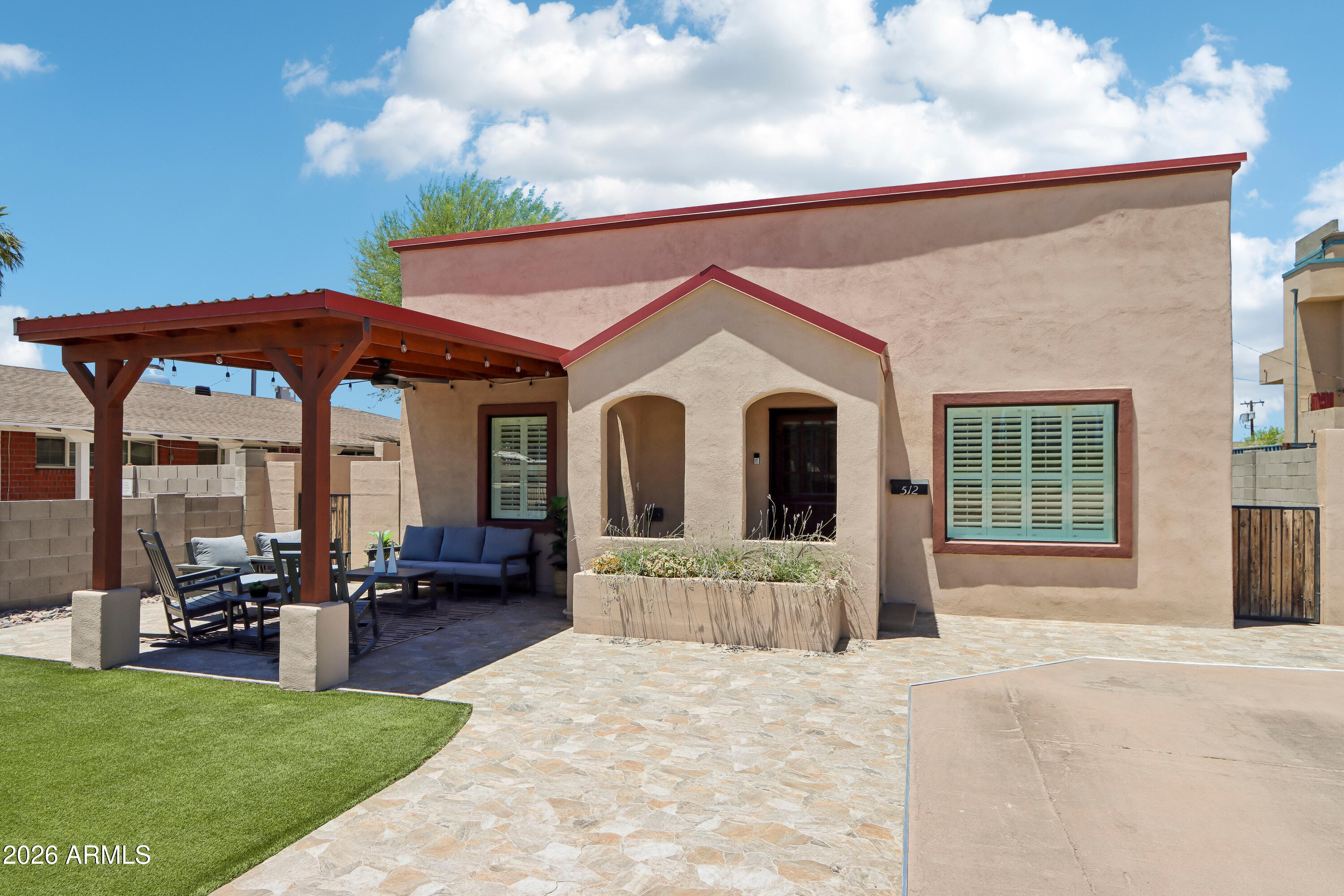 Be at the center of it all in this crisp 1930 Spanish/Southwestern-style home just minutes from Downtown Phoenix! Offering 4 bed/2 bath and approximately 1,700sf, this move-in-ready residence blends historic charm with modern updates. Recent 2025 improvements include luxury vinyl flooring, two remodeled baths, energy-efficient windows, granite countertops and a charming fireplace. Enjoy multiple inviting outdoor living spaces, including a private backyard pickleball court that doubles as an incredible entertaining patio, plus a covered front porch with skyline and sparkling city-light views. Walk to Grand Avenue First Fridays, restaurants, breweries, coffee shops, nightlife and entertainment. ADU plans may convey.