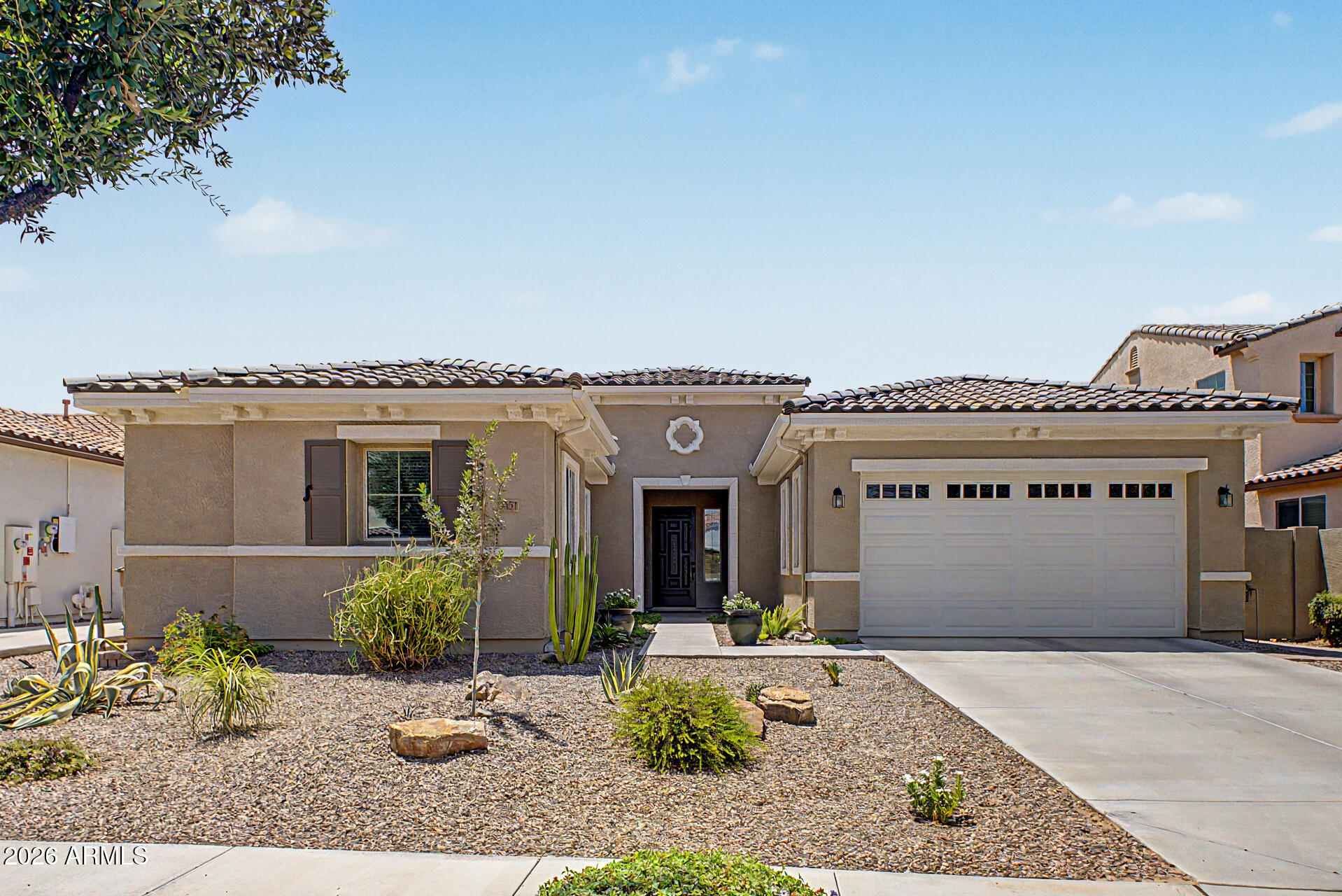 Welcome to this beautifully maintained 3-bedroom, 2.5-bath home with a dedicated office/den, perfectly situated in the highly sought-after Villagio community of Queen Creek. Built with modern living in mind, this exceptional home combines thoughtful design, quality finishes, and an inviting indoor-outdoor lifestyle that today's buyers are searching for.

Step inside to discover an open-concept floor plan filled with natural light, seamlessly connecting the spacious living area to the backyard through an impressive three-panel sliding glass door. During the cooler Arizona months, open the slider and let the soothing sounds of the backyard fountain create the perfect setting for relaxing evenings or entertaining family and friends. The chef-inspired kitchen is sure to impress,... featuring a gas cooktop, double wall ovens, granite countertops, a breakfast bar, extra cupboards that extend the entire wall, and a sunny breakfast nook. A convenient butler's pantry connects the kitchen to the formal dining room, making hosting effortless.

Every bedroom includes a walk-in closet, offering exceptional storage throughout. The private owner's suite is a true retreat, complete with dual vanities, a soaking tub, separate shower, and a unique pass-through door providing direct access to the laundry room for everyday convenience.

Outside, you'll find a peaceful backyard oasis featuring low-maintenance artificial turf and a beautiful central water fountain that creates a tranquil atmosphere year-round.

Located in the established Villagio community, residents enjoy scenic walking and biking paths, neighborhood parks and playgrounds, beautiful mountain views, excellent schools, and convenient access to shopping, dining, and everyday amenities. This is more than just a home--it's the lifestyle you've been waiting for.

Don't miss your opportunity to own one of Villagio's most inviting homes.