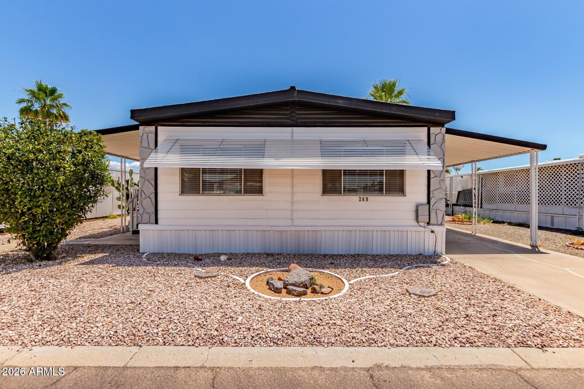 ''Motivated Owner!'' Selling AS IS. Reduced from the original asking price of $68,500, which reflects its condition, age, and any anticipated updates or repairs. Located in the desirable gated community of Friendly Village of Orangewood, this manufactured home offers 3 bedrooms and 2 bathrooms. The interior features neutral finishes, natural light, comfortable carpeting, and wood-look flooring.
The kitchen is with white cabinetry, tile backsplash, ample counter space, a pantry, center island, and built-in appliances. The primary bedroom includes generous closet space and a private ensuite bathroom with dual sinks.
Outdoor living is enhanced by a covered patio, perfect for relaxing mornings or peaceful evenings, along with a convenient carport for parking 2 cars. Community amenities include a pool, spa, clubhouse, and more, all within a secure, gated setting. This home offers comfort, convenience, and access to an active community lifestyle.
