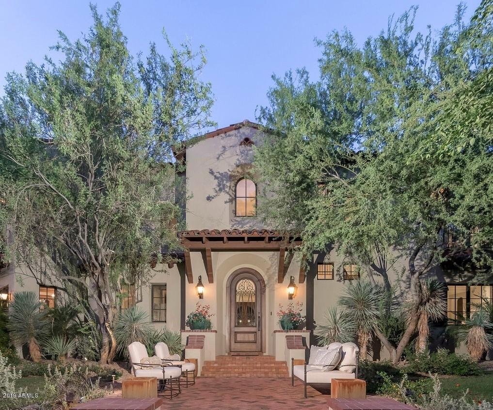 Arcadia at Silverleaf.  Authentic and charming, this magnificent Spanish Monterey custom estate is located on a premium corner lot overlooking one of Arcadia's signature parks and is the result of the superb craftsmanship of builder John Schultz of Schultz Development, and architect Mark Candelaria of Candelaria Design. This 8,174 sq. ft. home features 4 bedrooms, 4 bathrooms and 2 powder rooms with traditional Spanish influences and quality finishes throughout. Simply elegant and understated finishes include handmade tiles, stone and wood floors, beam ceilings, limestone fireplace surrounds and custom cabinetry.  This home is an entertainer's dream featuring a gourmet kitchen, custom bar, game room/media room and separate guest quarters. Outdoor entertaining is easy with numerous covered patio areas, charming fountains, large grass area, built in barbecue and sparkling spa and lap pool.