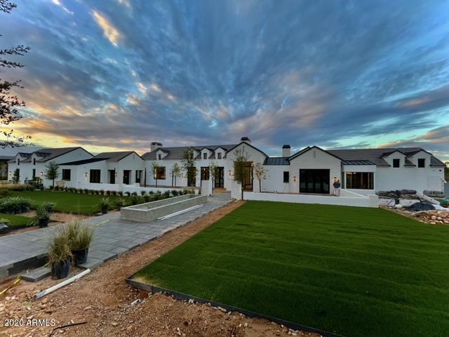 With all the hallmarks of a statement residence, this home by Tinker Development will inspire you: The impressive entry foyer with its soaring floor-to-ceiling window, the gorgeous symmetry of the great room where it meets the kitchen & a well-balanced floor plan speak to a vision carefully crafted into reality. Fresh finishes found throughout include bold patterned porcelain tile & tasteful pops of color in the cabinetry, tempered by timeless wide-plank wood flooring. Every bit as enticing is the impressive auto court and generous 5 garages. Savor the desert skies & formidable mountain views from this custom showpiece; tucked away from the hustle of urban life, yet minutes from the amenities of nearby Arcadia, Scottsdale Waterfront & Biltmore. Scheduled for completion in less than 30 days