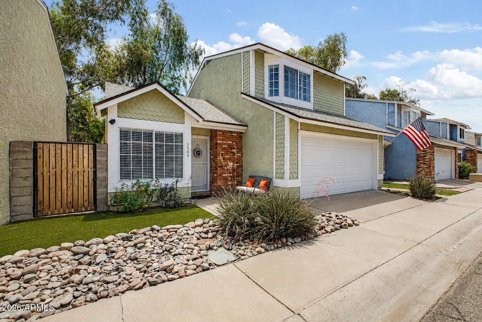 A gorgeous wood shingle exterior creates standout curb appeal and welcomes you into a bright family room with soaring vaulted ceilings. This completely move in ready home features two upstairs primary suites with private bathrooms, offering comfort and flexibility for a variety of living arrangements. The kitchen showcases tuxedo cabinetry with white uppers, gray lowers, granite countertops, and stainless steel appliances. Major updates include a newer roof, HVAC system, and water heater. Enjoy added privacy with a spacious backyard backing to Boojum Tree Hidden Gardens. Whether this is your first home, last home, or the one that bridges your next chapter, this home is ready to fit your goals and lifestyle.