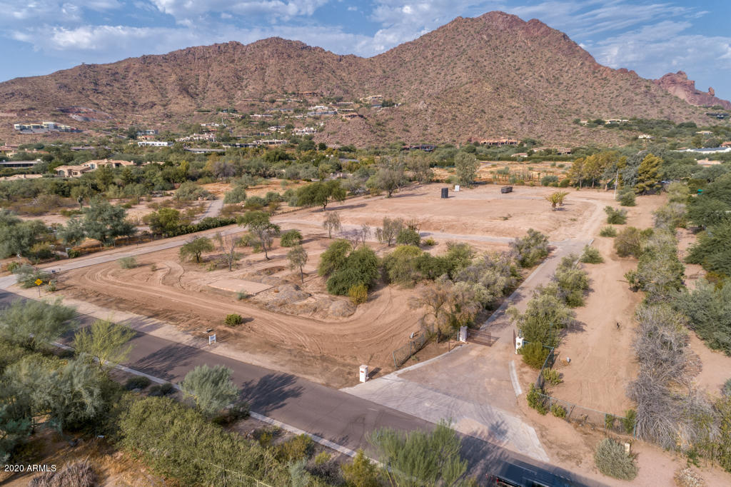 Magnificent Views of FULL CAMELBACK MOUNTAIN from this double electronically gated 4.8 ACRE LOT in prestigious CAMELDALE !  Views of the McDowell Mountains to the east.  Very quiet and private, this lot is in the most expensive area of homes in Paradise Valley. It is a wonderful site for a spectacular estate with room for guest homes, cars and sports activities!