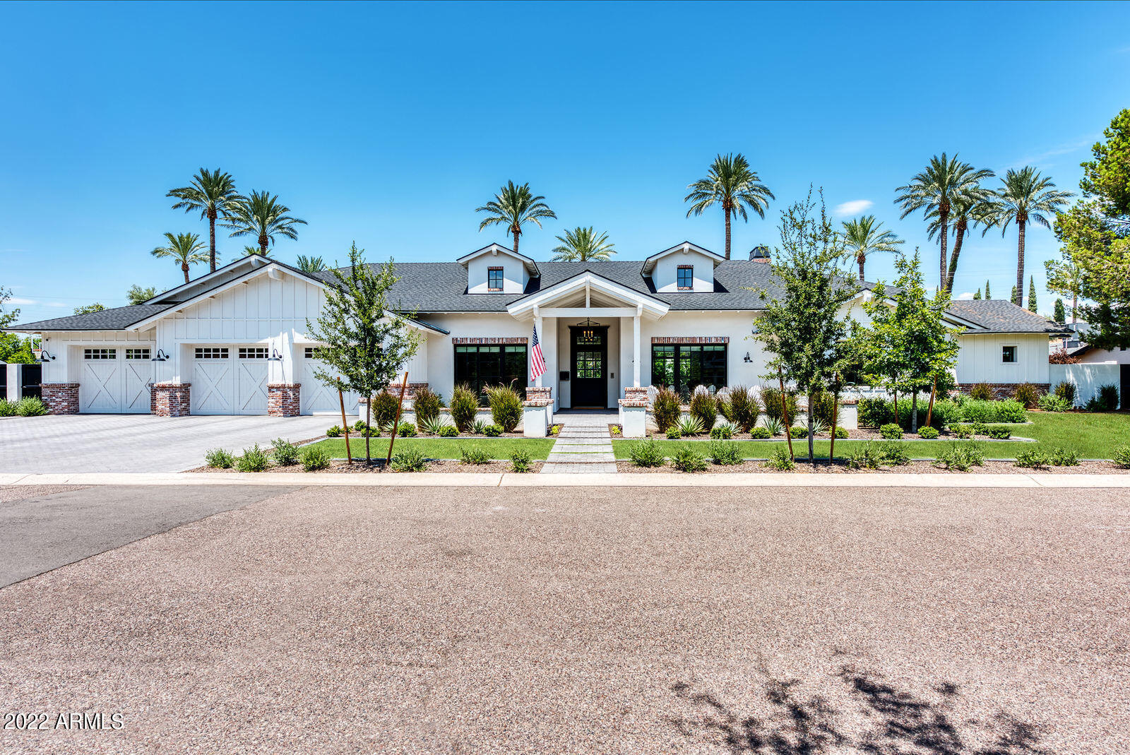 Nestled in one of the most sought after neighborhoods in the Arcadia area- this 4,780 sq ft home is exactly what you have been waiting for. A 2017 build with 4 bedrooms (all en suite), 4.5 baths, an office and secondary living space. The front yard living is quintessential, with brick patio spaces, custom fencing, a gas firepit and lush landscape. The backyard is stunning with large covered patio spaces, oversized pool, spa, garden with irrigated planters for vegetables, grapevines, citrus trees and two big grassy spaces. All of this and more on a half acre lot. Walk to LGO, Postinos, Ingos- you are close to it all!