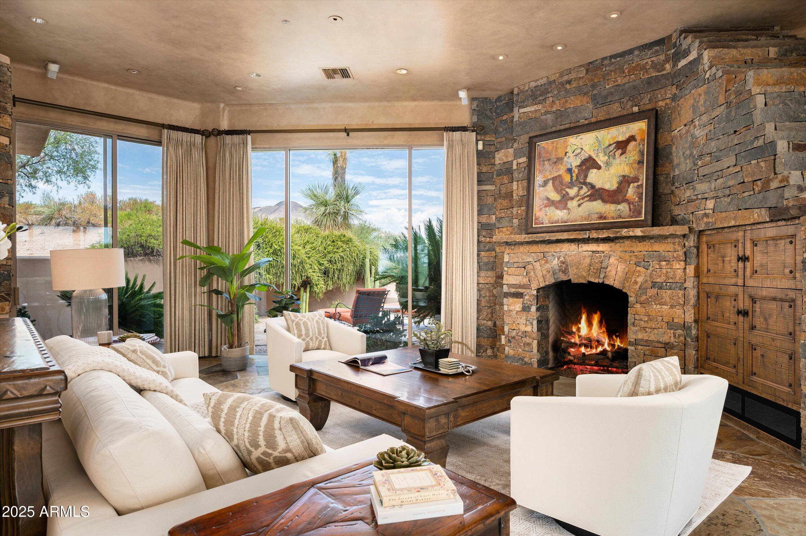 This stunning, timeless residence in Turquoise Ridge is nestled on a private cul-de-sac along a serene greenbelt, offering sweeping views of Cochise golf course, city lights, and both sunrise and sunset. Santa Fe accents add warmth and charm to this beautifully designed home, where style meets comfort at every turn. With GOLF MEMBERSHIP available to the exclusive Desert Mountain Club, you'll enjoy world-class courses and luxury amenities just moments away.Inside, the open-concept layout flows seamlessly from the gourmet kitchen to the spacious Great Room, featuring rustic beams, soaring ceilings, and expansive windows that flood the home with natural light, framing breathtaking desert vistas. The kitchen is a chef's dream, complete with high-end appliances, custom Alder cabinetry, and a convenient serving window to the outside pool patioperfect for entertaining. The office is beautifully designed, ideal for working from home, while the oversized three-car garage provides ample space for vehicles and storage, including a wine cellar. The home boasts three luxurious suites, each with its own private patio for quiet relaxation. The large primary suite has direct access to the pool and spa, offering the ultimate retreat. Multiple patios provide additional areas for guest entertaining, while the sun-soaked backyard, with a sparkling pool and shaded al fresco dining space, invites you to bask in the Arizona sunshine. For those seeking the best views, the upper patio delivers panoramic vistas, showcasing vibrant sunsets and the twinkling cityscape. This is a home where every detail has been thoughtfully crafted for both elegance and functionality, making it the perfect desert escape.