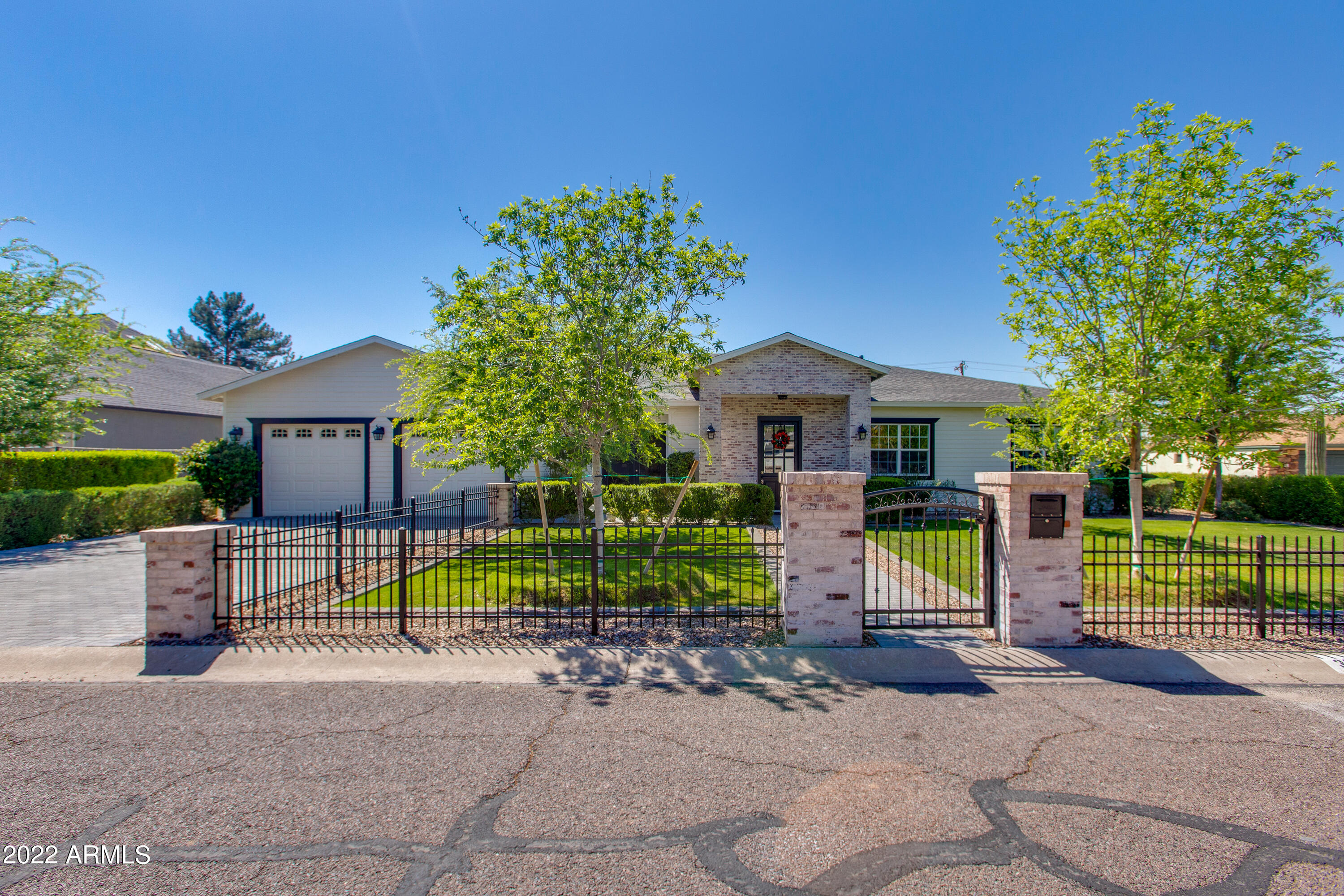 Situated on an oversized lot, this stunning 2017 build has all of the spaces and features for today's modern living.  This home boasts over 4,200 square feet including a massive great room open concept, chef's kitchen, wet bar area, separate dining room, 4 bedrooms in a split floor plan, and an office.  The master retreat has a large bathroom with stylish finishes, separate shower room, stand alone tub, two walk-in closets, and its own laundry area.  Two of the secondary bedrooms have a jack n' jill perfect for kids and the in-law suite features its own private bathroom.  Amazing indoor/outdoor flow makes this an entertainer's dream and the 3 car tandem garage is a bonus.  Located just steps from LGO, Postino, North, Chelsea's Kitchen, Kachina Park, and more!  Call today before its gone!