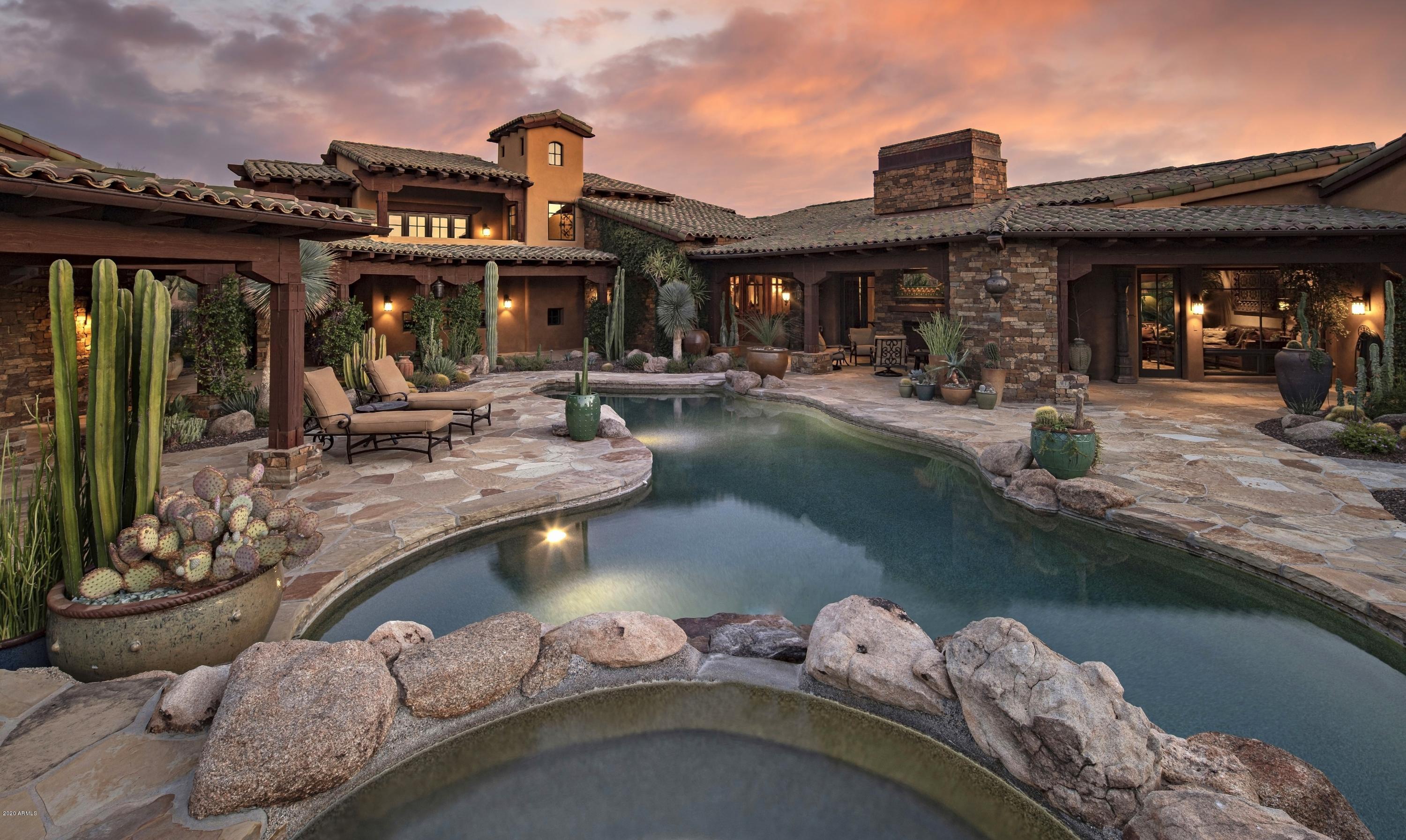* Elegant estate blending timeless architecture, privacy & views located on over 1.5 acres in the guard-gated community of Whisper Rock * Truly a serene setting with a sense of being in a botanical garden * Generous living spaces, private guest quarters, separate master retreat & detached casita provide ample room * Dual Master Suites (one on the main level) * Separate guest wing complete with dual en-suite bedrooms, media room/lounge with patio, laundry and powder room * Detached Guest House with kitchenette, laundry and bathroom accessible by pool area * Dedicated outdoor kitchen featuring a built-in wood burning pizza oven accompanies a bocce ball court, fire pits & stone fountain * Cozy fireplaces, natural stone & reclaimed wood floors, whole-home Control 4 automation, exotic granite slab counters, custom furniture grade cabinetry, designer appliances, rough sawn wood beams & Venetian plaster combine to create an incredible setting * Community amenities include concierge, fitness facility, heated pool & spa and 3-acre park *