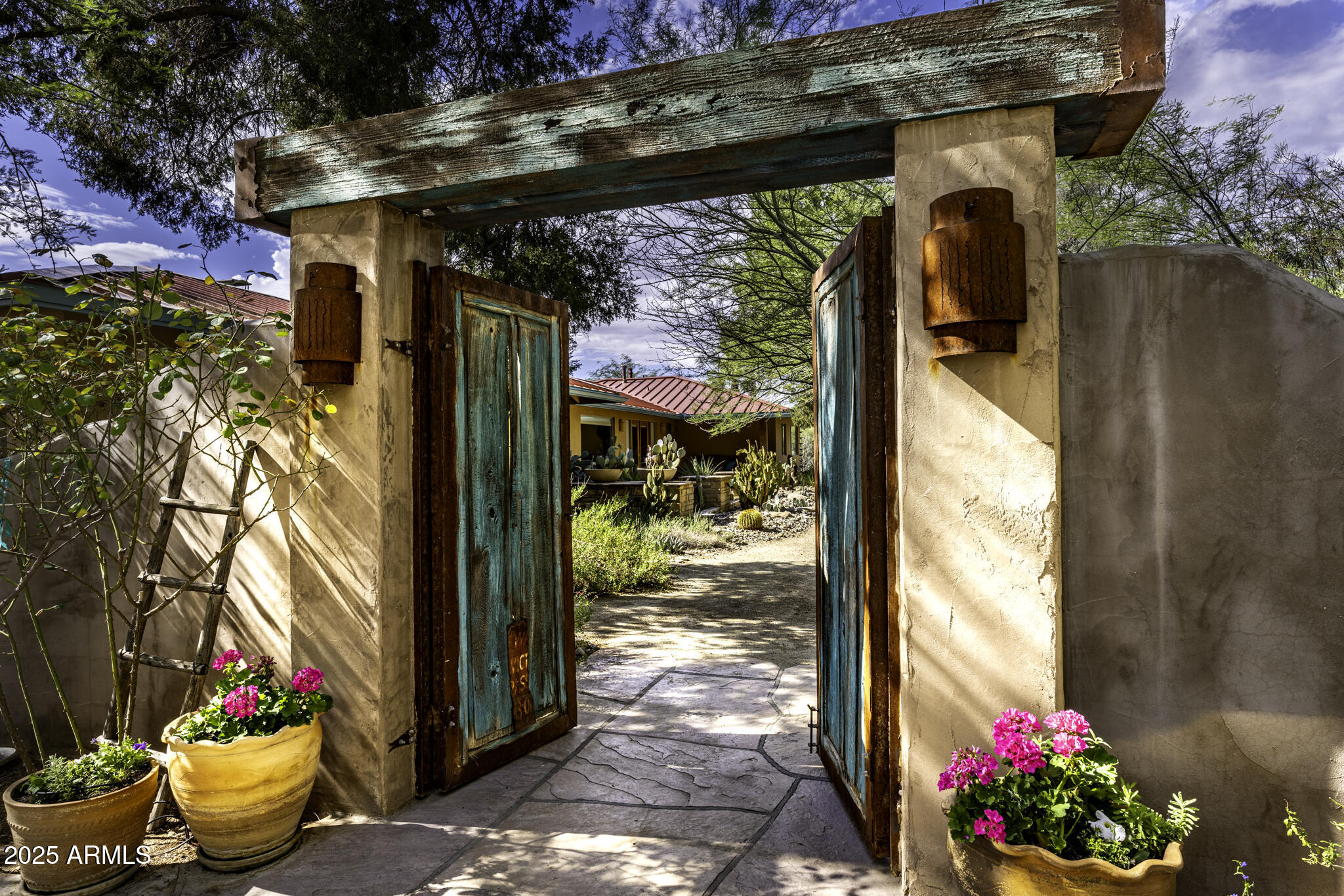 Discover the legacy of the Lazy RC Ranch, approximately 30 contiguous acres bordering the Hassayampa River with two private entrances directly accessible from Highway 60. This estate features a meticulously upgraded residence offering three bedrooms and two and a half bathrooms, library & den complemented by a detached three-car garage. Interior highlights include cherry wood cabinetry, Indian Piranha Granite countertops, an Ashfork stone fireplace, and a combination of wood, tile, and crisp white carpet flooring. Elaborate outdoor entertaining gallery overlooks the Hassayampa River, complete with intimate walking paths down to the riverbed. Extensive landscaping and water features surround the home and appear throughout the grounds. The property also boasts a 5,966 square foot
climate- -controlled workshop and event center, offering his and hers offices as well as a kitchen and full bath; adjacent to a quarter-acre pond stocked with Bass, Blue Gill and Catfish finished with waterfalls and hand-laid flagstone paths.

The centerpiece of the tranquil property may be the Pecan Orchard and the many varieties of fruit trees including apples, peaches, lemons, limes, pomegranates, and tangelos, harboring an abundance of wildlife.

A historic element, the Rock House or "Miners Ramada," originally constructed in 1920, serves as an inviting venue for outdoor events, quiet evening dinners and relaxation. Spanning nearly one mile, the property offers numerous trails and walking paths devotedly created with hand placed flagstone, river rock, and timbers.

Guests may enjoy the river walk overlooking the riparian nature conservancy, meditation points, and hilltop lookout areas amidst diverse elevations and mature arboreal landscapes.

Currently 6 RV Hookups strategically placed: two on the hilltop above the pond with extraordinary views and four nestled above the river walk overlooking the treetops of the Hassayampa River.

Additionally, on the opposite side of Hwy 60 one parcel being offered includes an income producing billboard.

Originally part of the historic Brill Ranch, established in 1866, when 700 head of cattle were driven from California to the pristine banks of the Hassayampa in Wickenburg, Arizona. The current ranch borders the Nature Conservancy and features direct highway access. The unparalleled privacy, prime location, and investment opportunity offered here is unprecedented in Wickenburg.

Transitioning from its origins as a cattle ranch to a guest ranch, and now a private retreat, the Lazy RC Ranch invites qualified parties to experience its rich history and explore the endless possibilities.