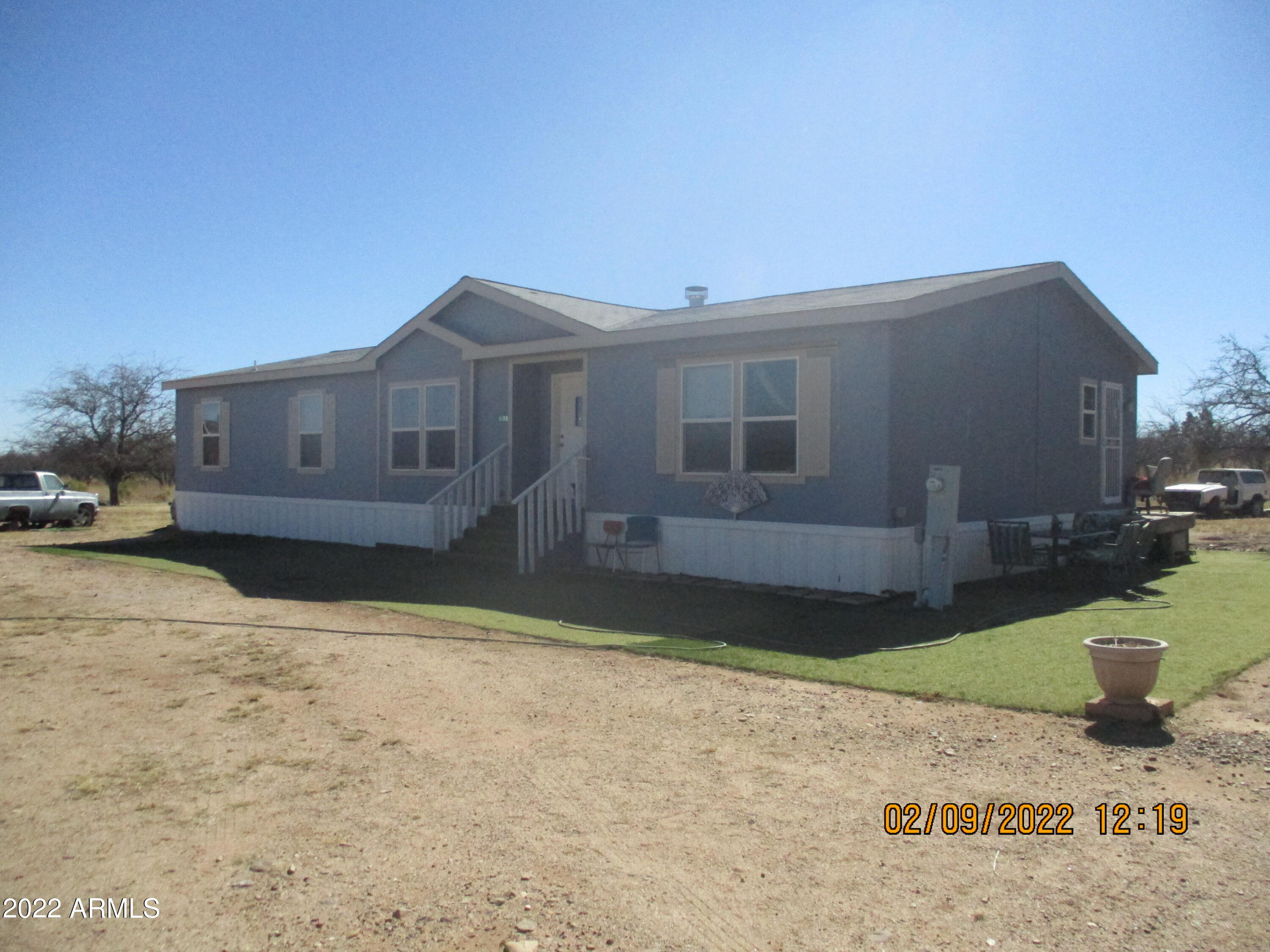 Property is located near Ramsey Rd, only a short distance off paved roads. Very Private location at the end of the block. Situated behind a large steel door, you are almost in a compound area. The property is far from Natural, many improvements to the land, mesquites have been trimmed, artificial grass gives you a clean front and side yard. Property has a wash to the rear behind a berm area, Home is elevated, Inside the interior is in Excellent condition and large bedrooms make it perfect for a large family looking for space. It has all the comforts of a Family home.