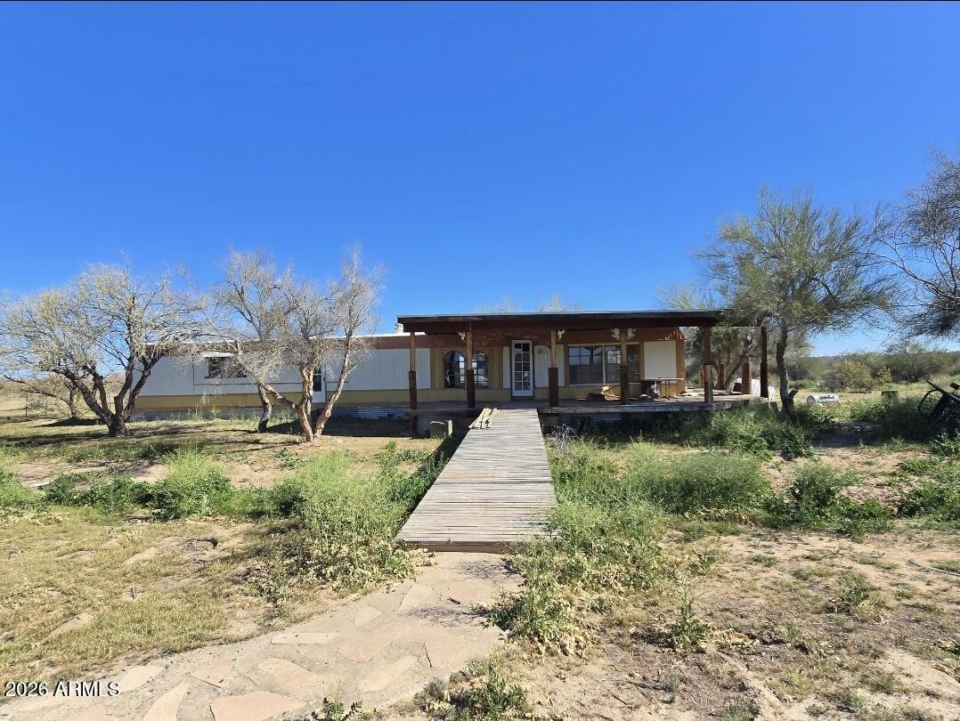 4.144-acre parcel lot located in Whispering Ranch offering Private well; well requires a submersible pump. Electricity is currently provided by generator. Located in a flood zone. Plenty of room for horses, toys,  while enjoying wide-open space and beautiful desert views. Existing structure, Single-wide manufactured home conveying strictly in its current and present condition with no repairs to be made by Seller..
