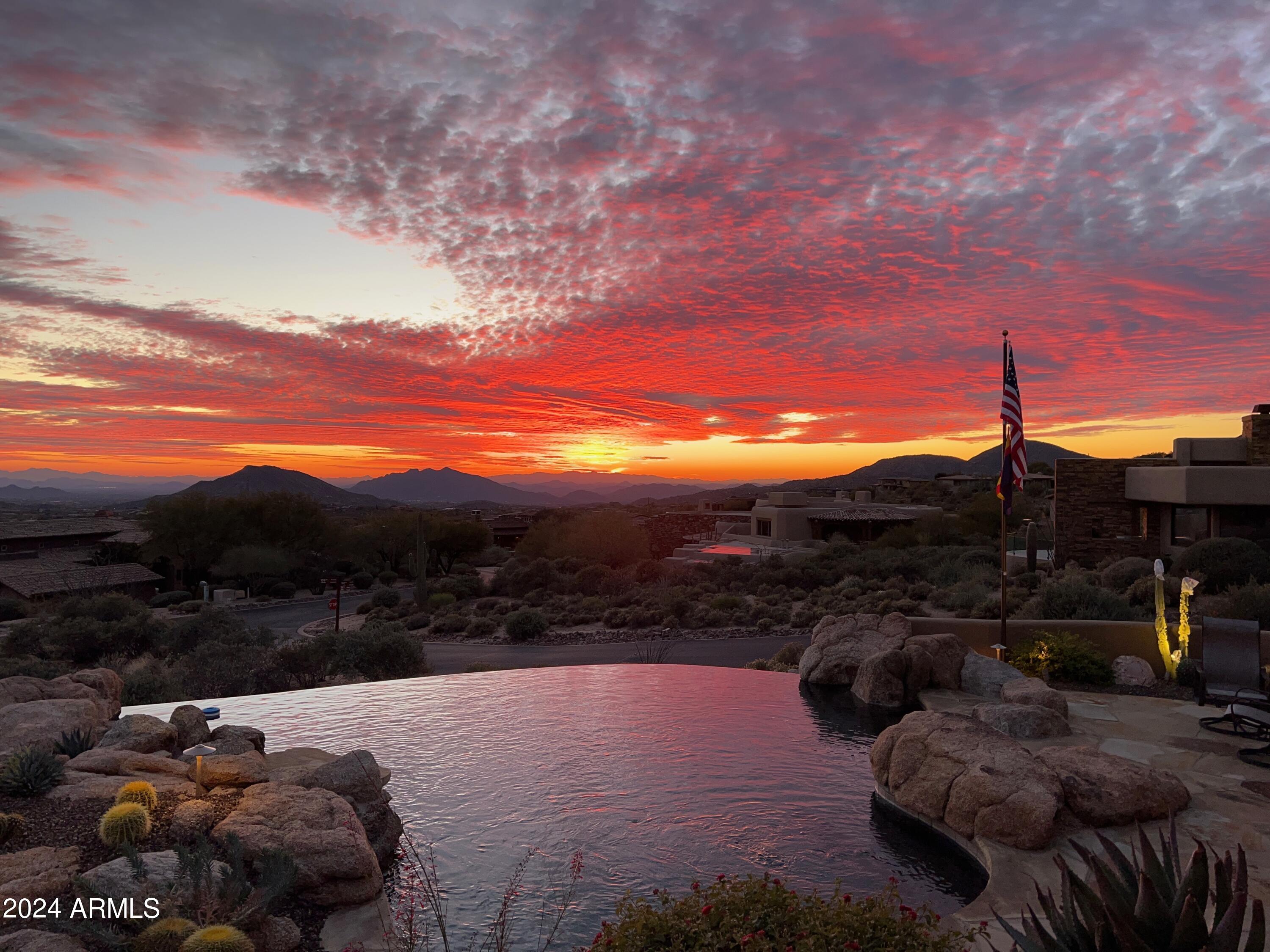 Golf Membership available from seller. Views, Views and Views is the best way to describe this wonderful home in Desert Mountain. Offering all the views Desert Mountain is known for from the McDowell Mountains all the way to the western mountains, from sunrise to sunset. In addition, the home also backs up to a wonderful display of natural rock outcroppings with views up to Apache Peak. The home was designed by renowned architect Bing Hu to take advantage of the terrific views from the main living areas-family room, living room, primary and second suite, both studies and kitchen. The open floor plan flows seamlessly from room to room. Two outdoor patios, one to take advantage of the gorgeous valley views and the other for the serene and peaceful setting amongst the boulders and Apache Peak. The chef's kitchen is ideal with dual dishwashers, dual ovens, dual beverage refrigerators, steamer, warming drawer, plate warmer and additional pantry with freezer. Exquisite finishes include hand plastered walls, custom accent paint, hand carved wood fireplace and cabinet detail. Original owner who built the home with extreme attention to detail in every aspect. Truly a must see! Home is available turnkey including all furnishings and some decorative items via separate bill of sale. All artwork, coffee table in living room and personal items are excluded. Some artwork may be available.