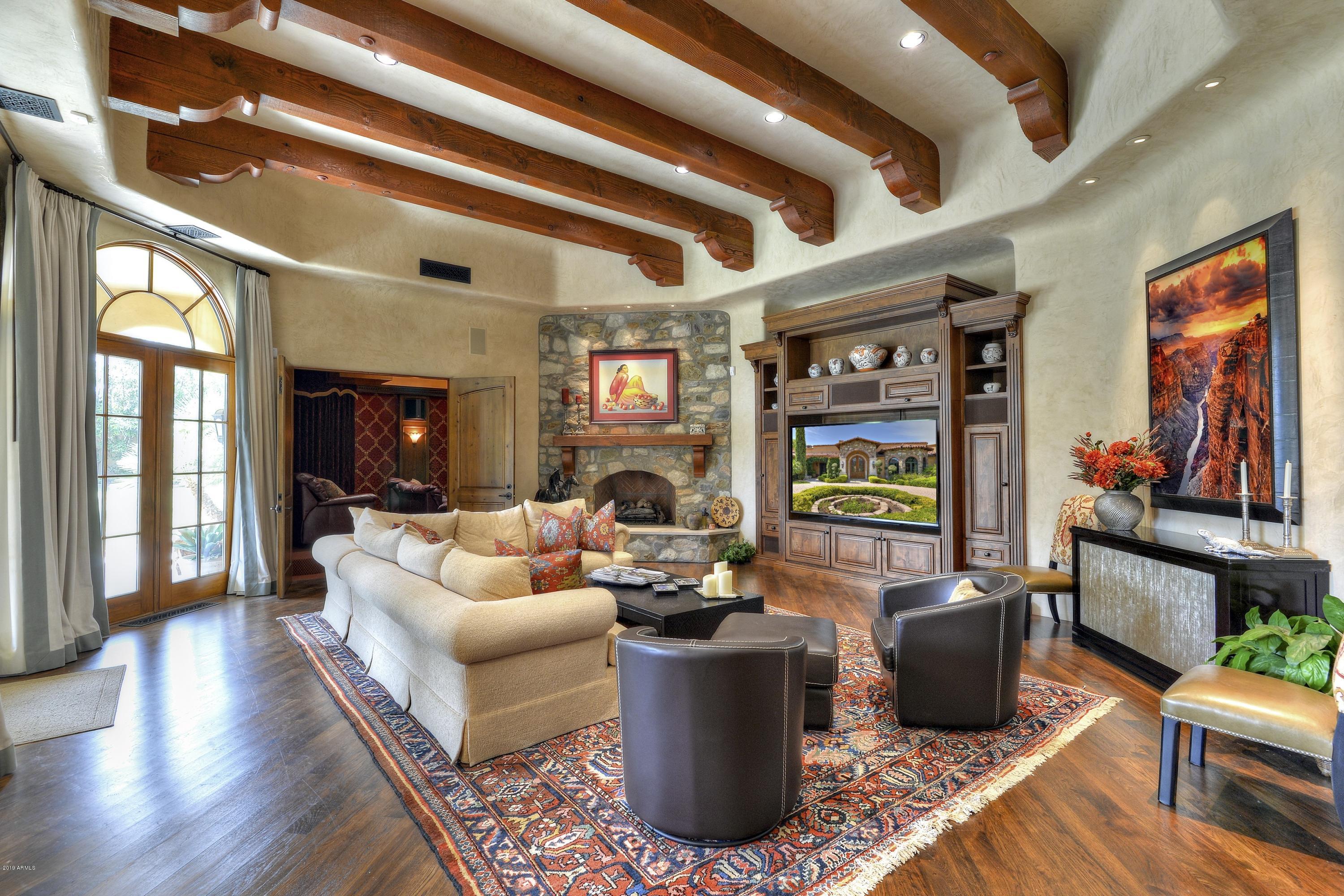 Elegantly appointed and privately gated, this European inspired property offers spacious grounds & interiors creating the feel of a very private compound.  Large Palladian windows frame the views of the outdoor pool & fountains, & lushly landscaped gardens, as seen from the floor to ceiling Venetian plastered walls T/O.  The Master Suite has a gracious entry, private patio & waterfall, separate His & Her closets, W/C's, vanities.  Her closet is magnificent!  Handsome study nearby, wide hallways w/ art lighting, Butler's Pantry designed to serve both living and dining rooms. Formal Dining Room incl. temp controlled wine cellar w/ custom stained glass panels.  Rich fabrics drape every window.   Sumptuous home theater accessed thru fam rm. Separate full Guest House.  Court says SELL IT NOW!