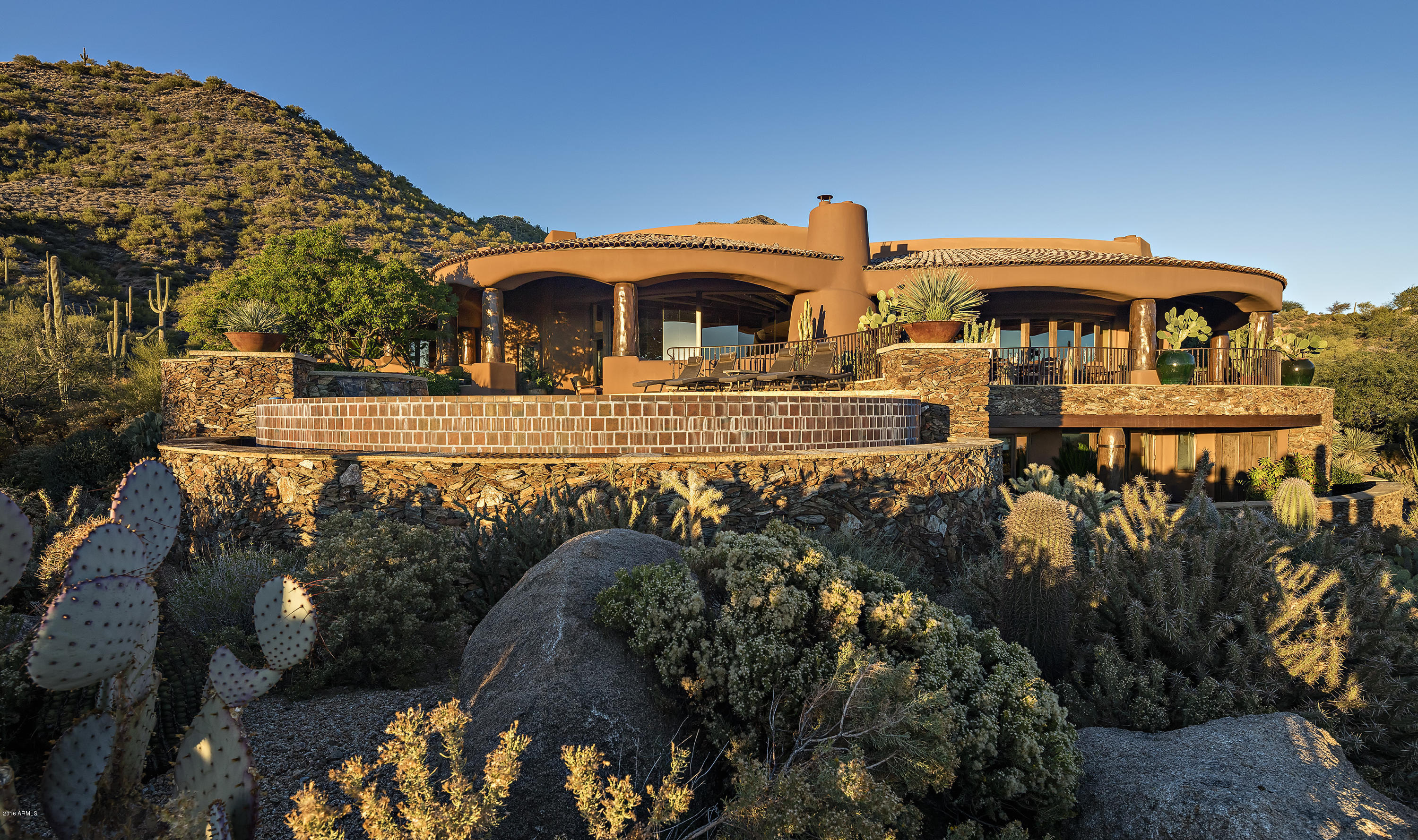 This Southwest Masterpiece overlooking Chiricahua's first fairway is surrounded by 15+ acres of open preserve & offers amazing golf and valley views. No amenity was overlooked in this award-winning Desert Mountain home created by a ''Masters of the Southwest'' team including Urban Design, Manship Builders & Bess Jones Interiors. Great Room concept, expansive windows and retracting doors offer seamless indoor/outdoor living; A+ wine cellar, executive office, chef's kitchen, exquisite master, A+ resort patio & stunning attached casita. Custom cabinetry, artisan doors, detailed ceilings, custom hearths, stone & copper elements, and flooring of chestnut, mesquite & onyx together reflect master craftsmanship thru-out. Drop-dead gorgeous landscaping crowns this desert paradise. Lower level is accessed by a grand staircase and features a spacious yet cozy family/entertainment room with two en suite guest rooms, workout room (5th ensuite guest room) and laundry. Entertaining patio with generous overhang wraps the southern exposure and is accessed through glass doors that open to the expansive outdoor Living/Dining/Kitchen/Pool/Spa. House technology includes Crestron System for home audio, lighting and shades, Nexia System for 6-zone HVAC, elevator, A/C garage, built-in patio heaters, generator, and 600 amp service.  Furnishings are available by separate agreement. Golf or Lifestyle Memberships are available by application to the Desert Mountain Club featuring 6 Nicklaus golf courses, 6 restaurants/club houses, Flick golf learning center, fabulous new spa/fitness center, equestrian center and 16+ miles of private hiking trails in the Tonto National Forest! See "Documents" for detailed "Special Features".