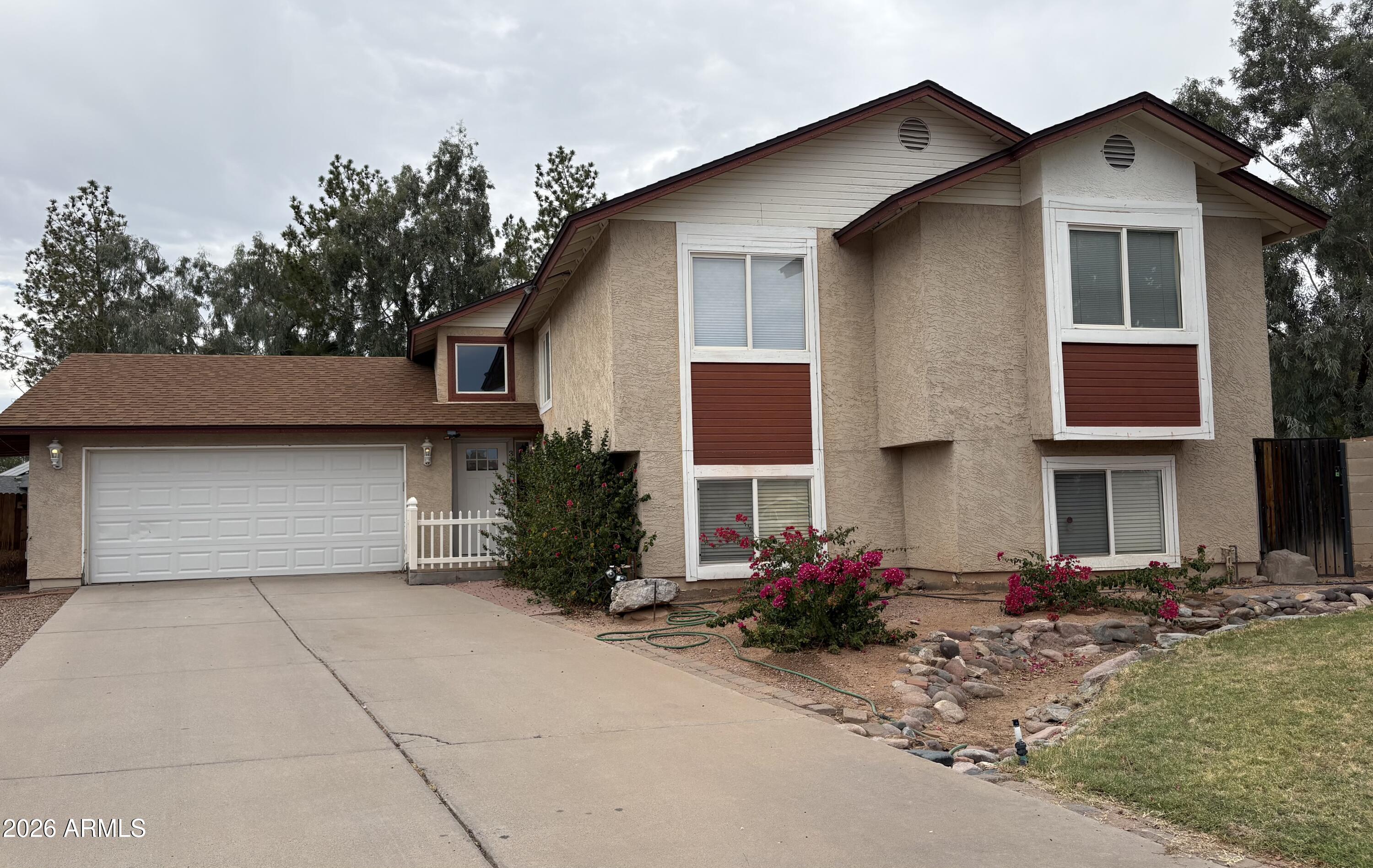 Spacious split level home tucked away on huge cul de sac lot.  This is a wonderful home for a  family  or possibly multi-generational home.  Main floor has a formal living area and large family room along with the large  primary bedroom with ensuite bath.  Large kitchen opens to deck overlooking  apx. 1/3 acre lot.   Downstairs has 4 bedrooms, 2  full baths and  kitchen.  Designed so that part of the downstairs could be it's own 1 bedroom apartment.  RV parking, large storage shed, covered patio and extra concrete slab are some of the outdoor features.  Garage has mini-split air conditioning.  The features and possibilities of this home are endless!