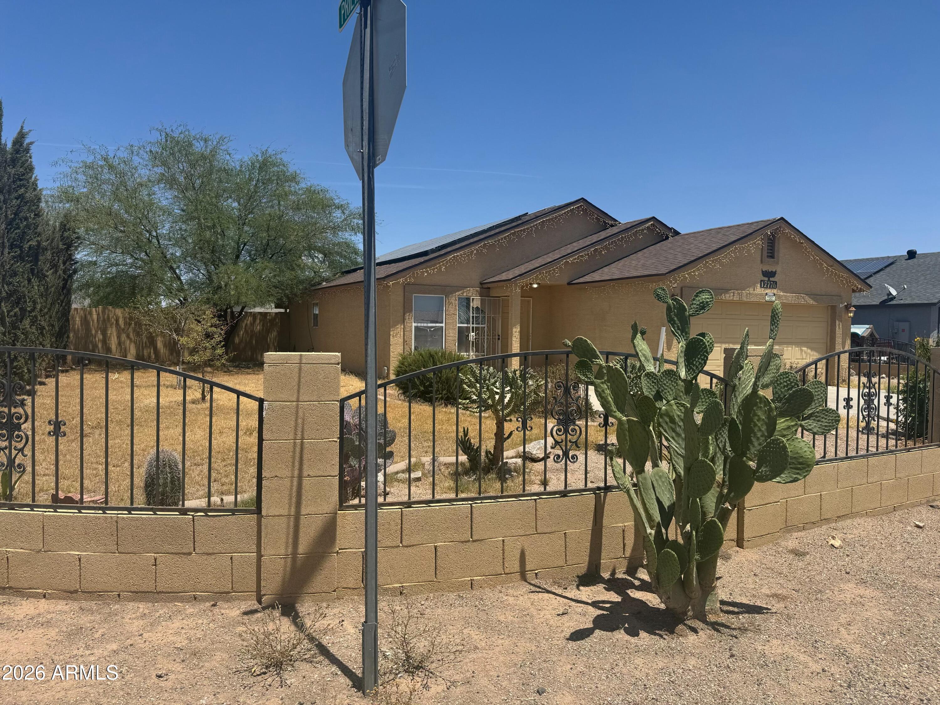 WOW Amazing 3 bed 2 bath on an awesome CORNER lot in Arizona City. NEW stainless steel range, dishwasher and microwave, upgraded cabinetry, granite countertops throughout, tile and laminate flooring throughout, no carpet, RV gate, full block fence and more.