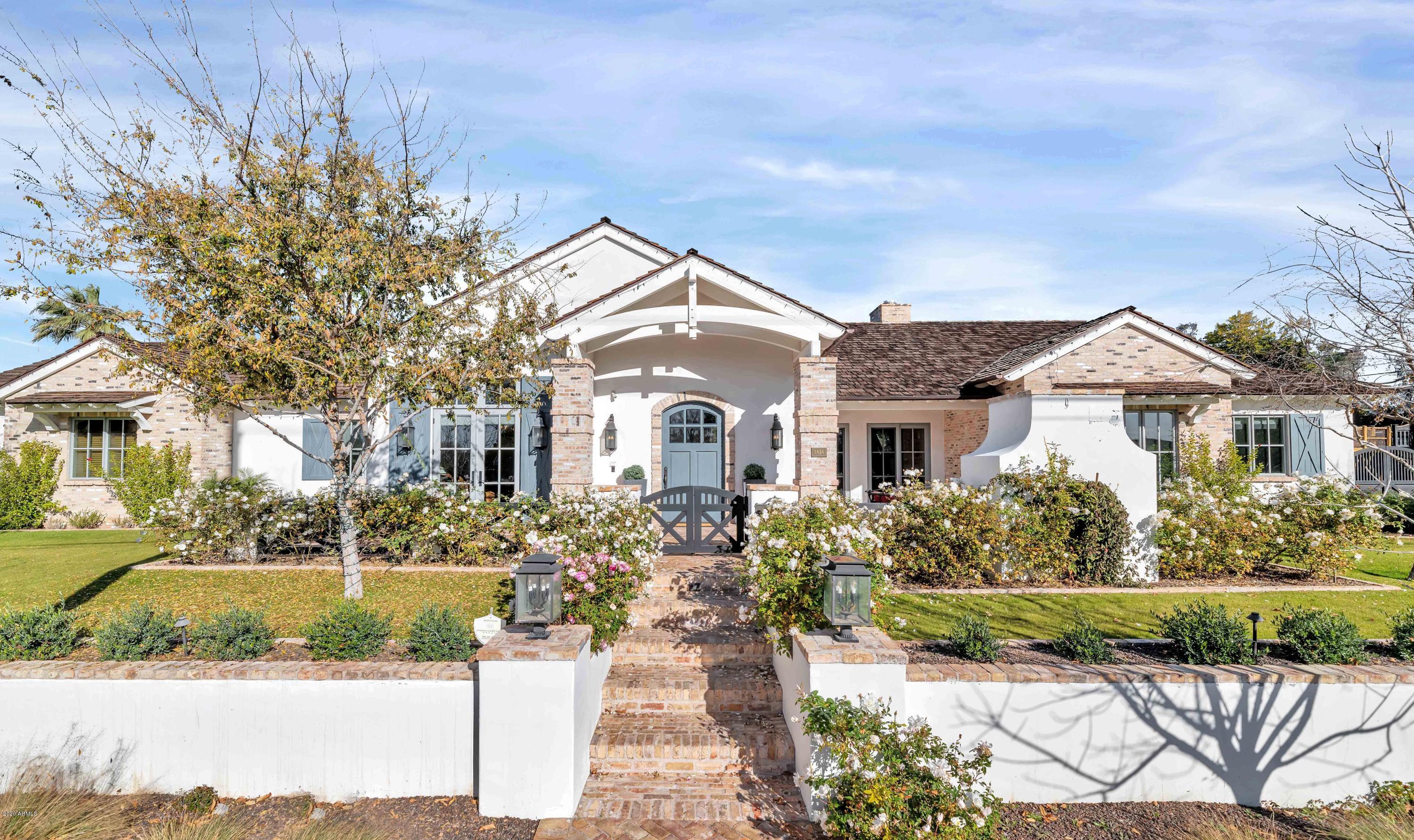 Quality, Originality, Creativity and Pure Beauty! Sitting on one of the best lots in Arcadia, this custom showpiece is beyond impressive with room after room of impeccable style. From the kitchen to the master hideaway, you'll find up to the moment finishes and fresh design ideas including exceptional millwork, sleek surfaces, exposed brick, dramatic lighting, custom ceiling designs, artistic tile and gorgeous flooring. There are so many special spaces that it will be hard to pick a favorite from the great room, den, playroom, home office, the wine room or bathrooms, because each and every space is just phenomenal. The setting is a personal playground for the kids and adults alike with a courtyard entry, fireplace, pool, spa, ramada, huge covered patio, putting green, playground and beautiful lush yard. Not a detail was overlooked inside or out of this magnificent family home!
