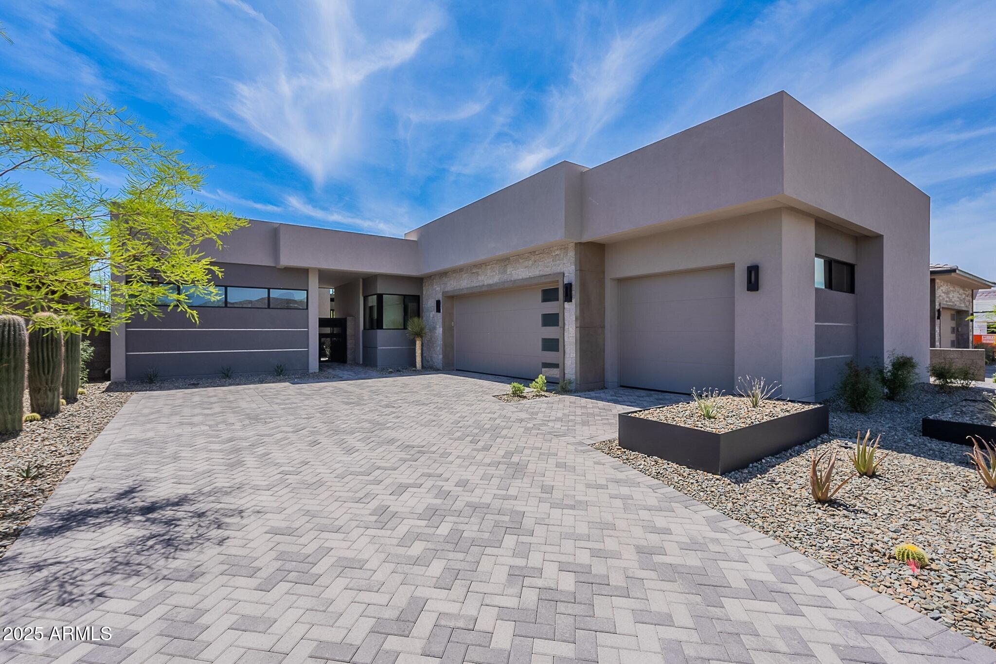 A full golf membership is available immediately!!! This Radiant Mirage Lock-and-Leave Custom Home by Cullum Homes is fully furnished and move-in ready! A gated, private landscaped courtyard welcomes guests, leading to a separate ensuite casita perfect for visitors. The large glass front door opens into the great room, featuring a floor-to-ceiling stone fireplace.
The chefs kitchen and breakfast room showcase stunning attention to detail, with mixed materials, custom quartz cabinets, and top-of-the-line appliances, including Sub-Zero, Wolf, and Cove. A spacious butlers pantry offers abundant storage. The custom wine cellar and dry bar add a special touch for entertaining. All bedrooms are thoughtfully separated for privacy, with the primary suite offering serene views of the 10th hole of the Seven Golf Course
and distant mountains. The primary bath is exquisite, with double sinks, a soaking tub, a large shower, and a custom walk-in closet by Closet Masters. The two guest ensuites comfortably fit king-size beds.
Additional features include an office, and a laundry room with ample extra storage, and a built-in desk. The single-level layout is completed with a 3-car garage for all your toys and golf cart.
Step outside to enjoy the backyard oasis, featuring a Baja shelf in the pool, an outdoor BBQ, and a fire pit, all with stunning golf course and mountain views. The Seven Clubhouse is just a short walk away!
Dont miss the opportunity to visit this exceptional home today. Seven Desert Mountain offers an unparalleled lifestyle-start golfing today!