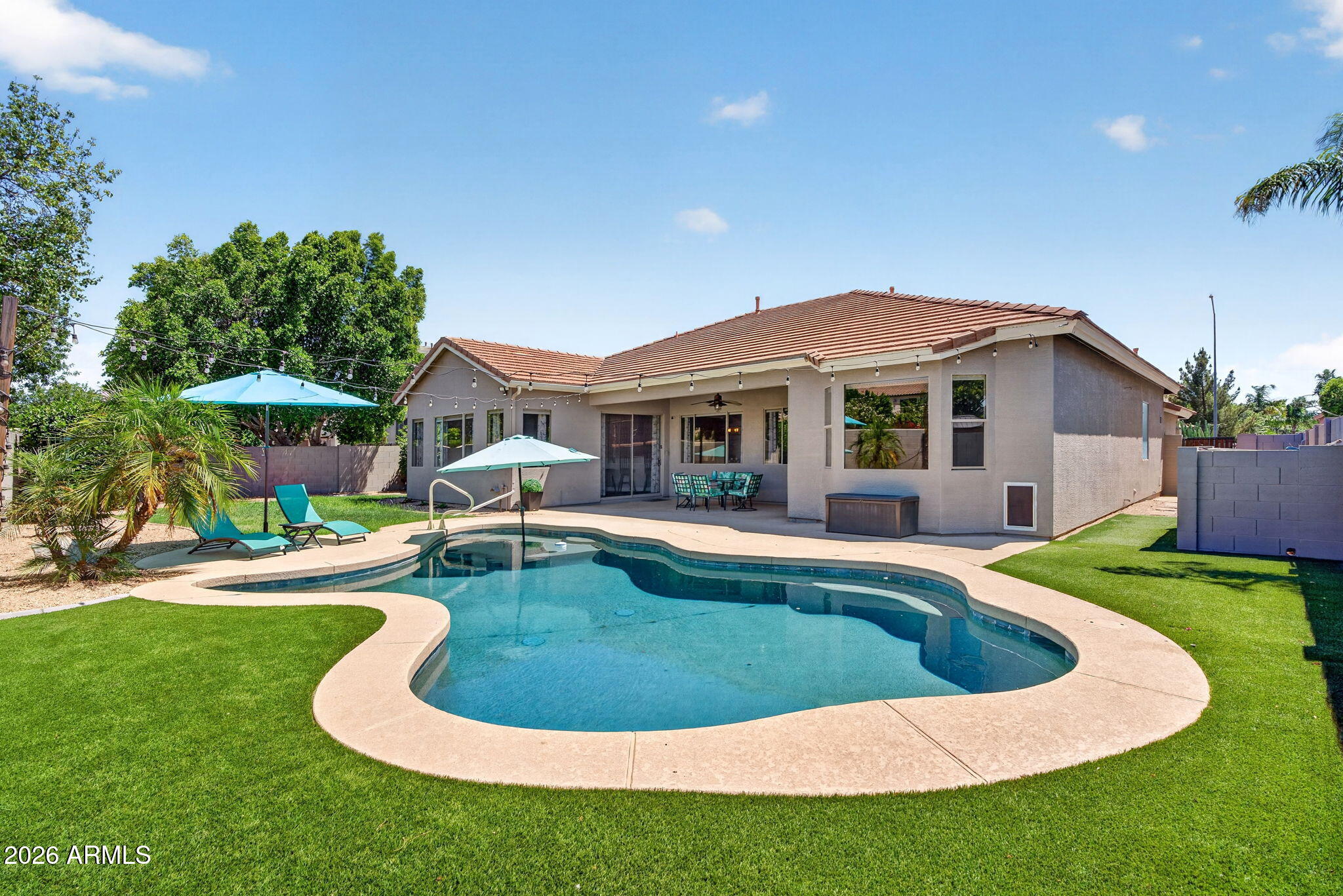 Welcoming curb appeal to this beautifully maintained single story Mesa home. Spacious and open split floor plan offers 4-bedrooms, 2-baths, formal living and dining rooms, & large family room. Expansive windows throughout offering  bright living spaces, comfort & functionality. Kitchen, open to family room with s/s appliances, granite countertops, oak cabinetry, large island, breakfast bar, & pantry. The split primary suite includes backyard access, dual sinks, walk-in closet, separate tub and shower and private water closet.  Large bonus room works great for home gym, office, game room, etc. Enjoy Arizona living year round in the private backyard with heated pebble tech pool,  covered patio & no neighbors behind you. Augusta Ranch community amenities include award winning 18 hole executive golf course, clubhouse, playgrounds, & biking/walking paths. Conveniently located with nearby access to freeways, shopping, dining, and parks. Location is key and Augusta Ranch is situated where a lot of new growth is in the works! A perfect blend of everything you need close by all tucked away in a quiet community your new home!