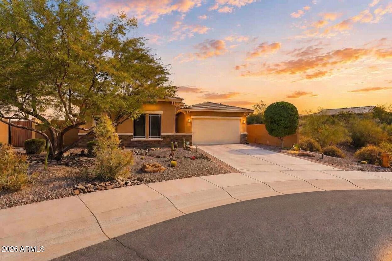 Luxury living in the gated Golf Canyon community at Estrella Mountain. Situated on a premium cul-de-sac lot, this exceptional home offers privacy and sweeping open scenery. Lightly lived in by seasonal owners, it shows like new. Built by David Weekley Homes with soaring ceilings, 8-ft doors, custom tile, and a striking Stone Feature Wall. Gourmet kitchen with high-end appliances and oversized granite island. Spacious primary suite with spa-inspired bath. Flexible den ideal as office or 4th bedroom. Owned Solar, EV charger, Split 3rd car garage perfect for a casita, shop, or gym. Resort-style backyard with custom built in fireplace, soothing water feature, Panoramic Views with no block walls to impede the scenery! Fully Furnished. New Roof. Surrounded by World Class Golf Club of Estrella!