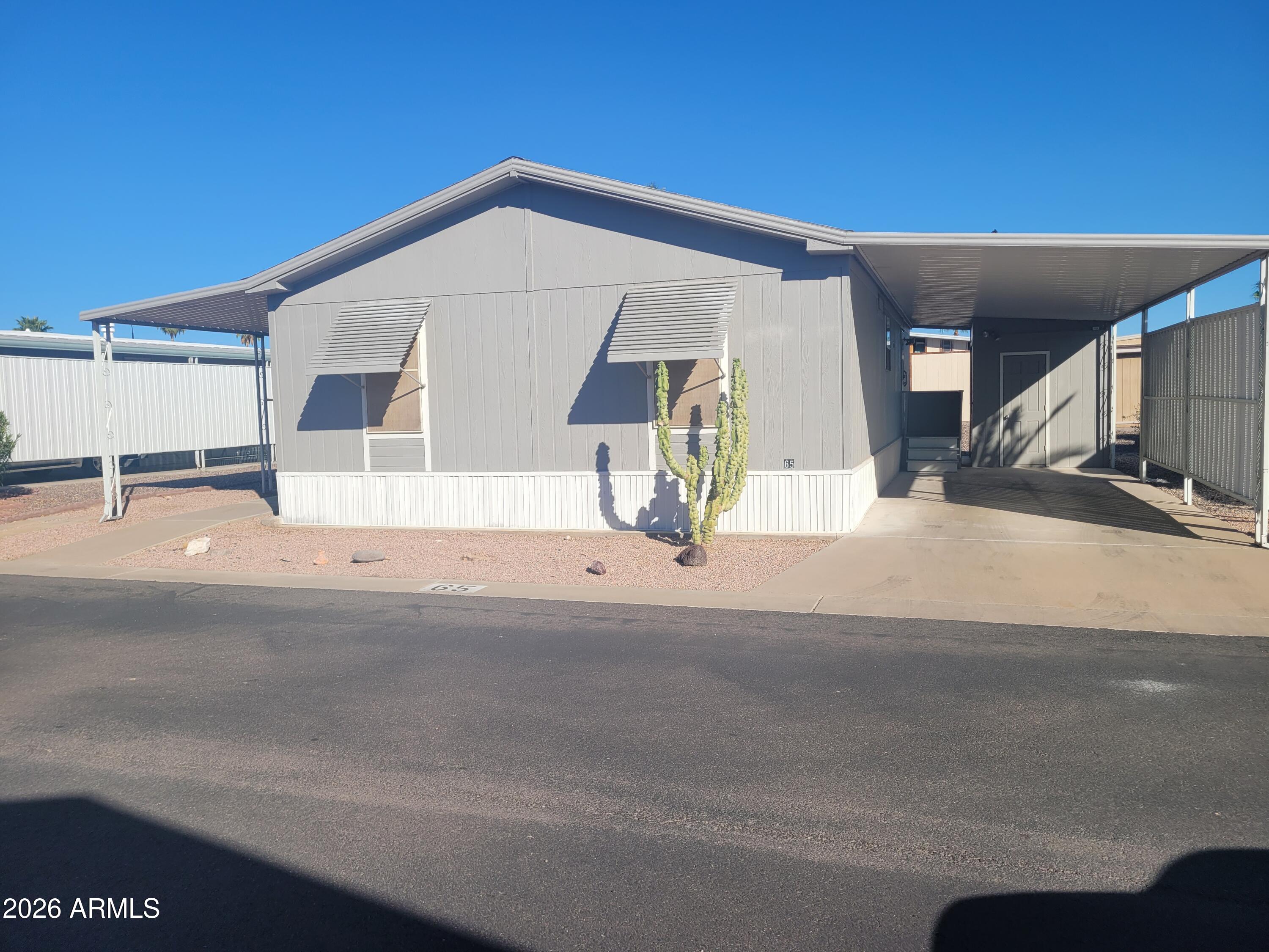 Beautifully remodeled home with new flooring, appliances, light fixtures, updated kitchen countertops and cabinets and updated bathrooms.  Ceiling fan in living room, laundry room with hookups, a shed, rebuilt front deck with awning.  
Community has a heated pool, clubhouse, activities and more!