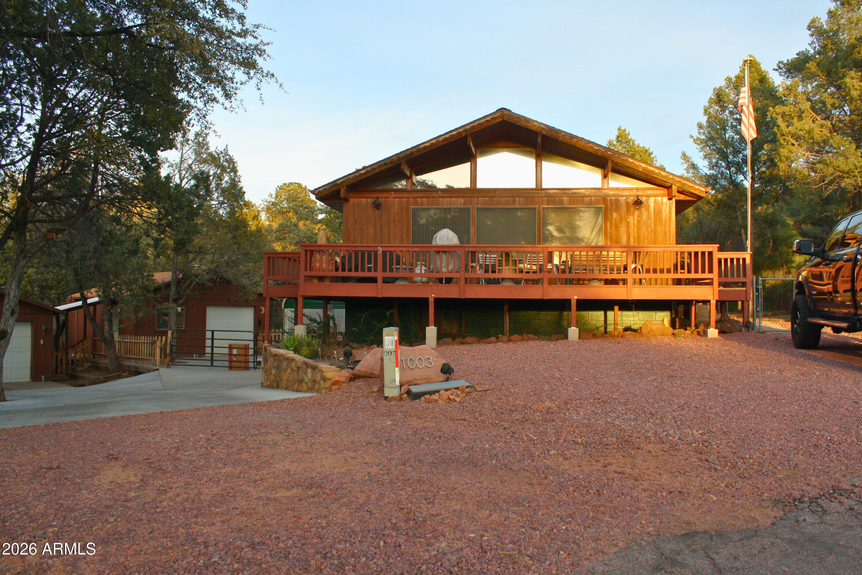 Motivated seller! Nestled in the tall pines of beautiful Payson, this inviting 3-bedroom, 2-bath home offers approximately 1,836 square feet of comfortable living space on a .23-acre lot with no HOA! Thoughtfully maintained Lindal Cedar home with vaulted T&G ceilings, cathedral windows and spacious living room - this property blends classic charm with the peaceful setting of Rim Country living. Remodeled with specific care of detail in mind you will love what you see when you step inside! This spacious layout features a welcoming living area, abundant natural light and views for miles right off your front deck! The kitchen offers ample cabinetry and workspace, flowing seamlessly into the dining and living areas. The primary suite provides privacy and comfort, while the additional bedrooms offer flexibility for guests, hobbies, or a home office with a separate entrance as well. Outside, enjoy mature trees, fresh mountain air, and a yard with room to relax or create your own outdoor retreat. The property offers the tranquility of a quiet neighborhood while still being conveniently located near local shopping, dining, and outdoor recreation. You also have not 1 but 2 garages so you can have that extra space for a workshop and still park your vehicles in the ''other'' garage. Could be made into the mother-in-law space and you STILL have a covered carport and plenty of open area space for your vehicles! This one is a must see so check it now!