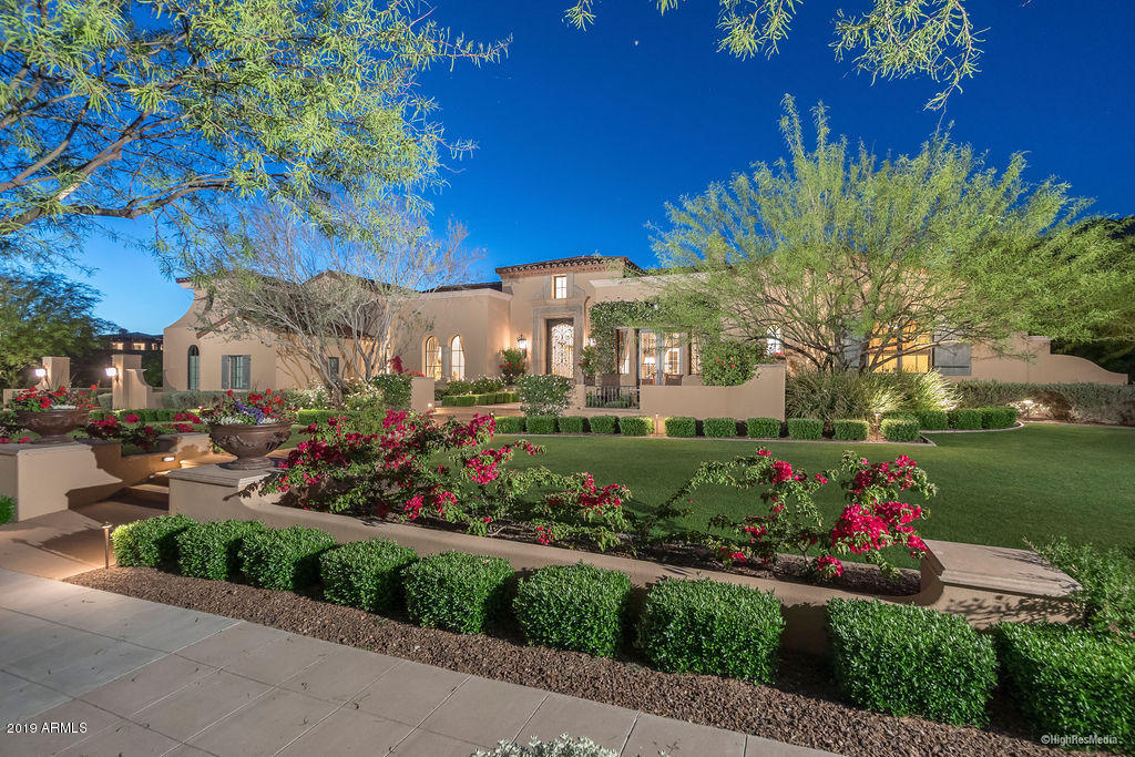 Enjoy forever mountain views from this elegant Formal Mediterranean Estate located in the premier Silverleaf community. Architect Dale Gardon in collaboration with Salcito Custom Homes created this masterpiece situated on the double 8th/9th and 10th fairways of the Silverleaf golf course. Exquisite finishes and details are evident in every room offering an abundance of natural light throughout. The kitchen, equipped with Viking and Sub-Zero appliances opens to the family room and breakfast area offering access to outdoor living and gathering space for entertaining. Included are Control 4 AV and Lutron lighting system, wine room, separate office with built-in cabinets and a spacious laundry room. Pristine, lush landscaping envelops the property providing privacy and tranquility.