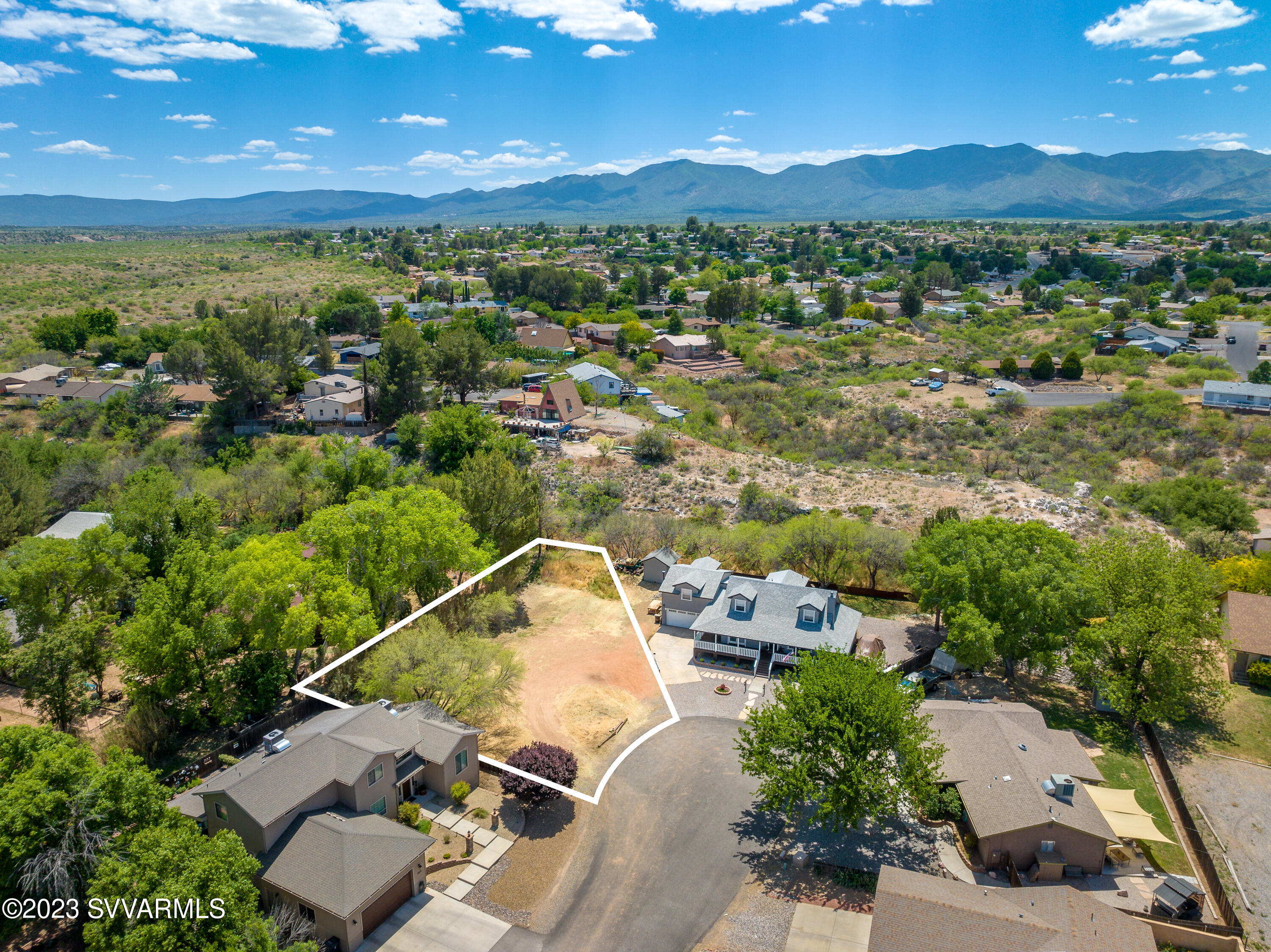 This mostly level lot is surrounded by lush greenery and custom homes at the end of a cul-de-sac. Just a short stroll through an old growth Cottonwood tree forest to one of Arizona's last year round running rivers. The Verde River offers endless activities such as fishing, kayaking, bird watching, swimming and more. Utilities available at lot lines, buyer to verify. Walk this property today and see all it has to offer in person.