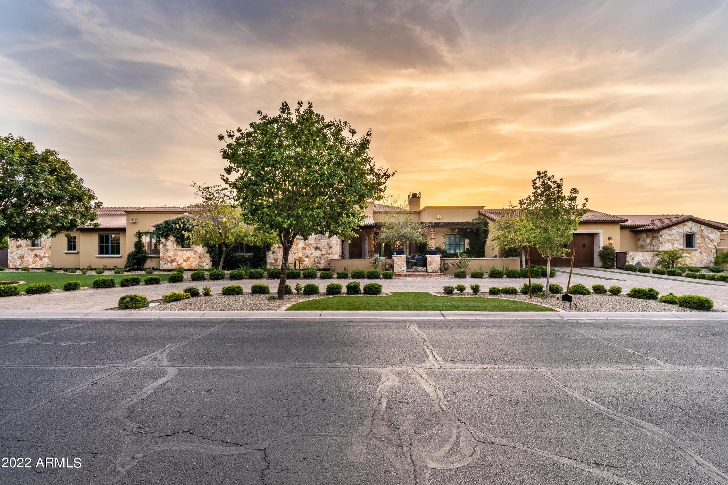 This custom home sits on a waterfront lot with beautiful mountain views.  Ski/Tube/Wake & Paddleboard on the private 13 acre lake with 236' of lakefront beach. 1 acre lot. Main House has 5,490 sq. ft.  742 sq.ft. casita/pool house with roof top deck!  Casita shows off a kitchen with large island, plenty of space and private bathroom. The main home shows off custom features throughout.  Extended 6 car garage with its own AC.  Boathouse with hydrolift as well.  This home shows off a movie theater room with upgraded lighting and sound system.  All new upgraded high efficiency AC units as well.  This home is stunning and move in ready!
