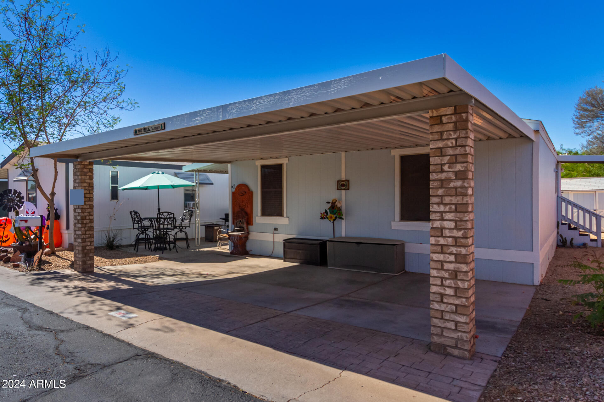 Affordable living meets modern style in this beautifully updated 3-bedroom, 2-bath double-wide manufactured home in desirable Northeast Phoenix! Located in pet-friendly Buffalo Ridge Mobile Home Park, this move-in-ready home features an open-concept floor plan, updated flooring, modern fixtures, spacious living areas, and a bright kitchen with stainless steel appliances. The split-bedroom layout offers privacy, including a comfortable primary suite. Enjoy covered parking and a low-maintenance lifestyle in an all-ages community with resort-style amenities including a pool, clubhouse, dog park, playground, and basketball court. Conveniently located near shopping, dining, freeways, and Desert Ridge. Affordable land lease community.